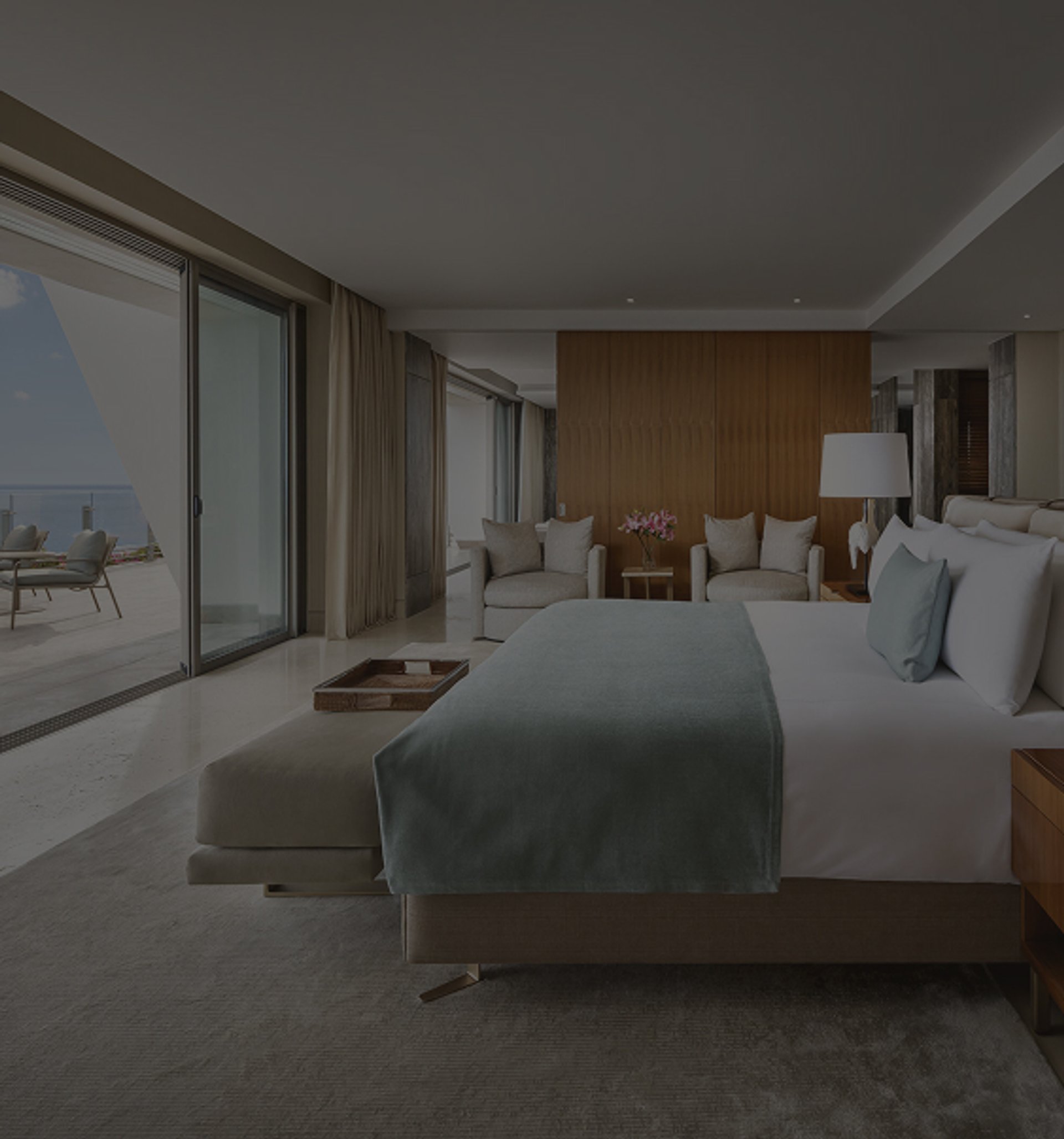 Luxurious bedroom with king bed, ocean-view balcony, and private plunge pool.