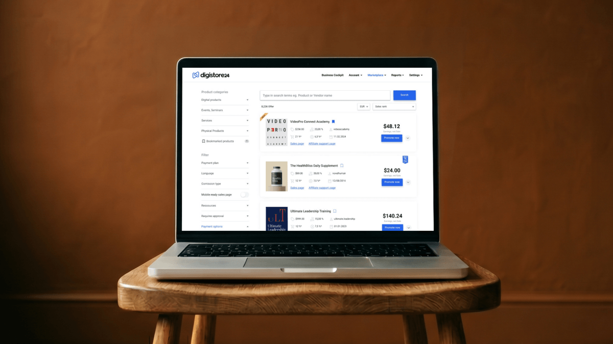 A laptop on a wooden stool displaying the Digitstore24 product dashboard.