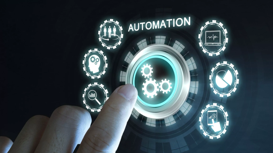 Hand touching a holographic "Automation" interface with gears and various business icons.