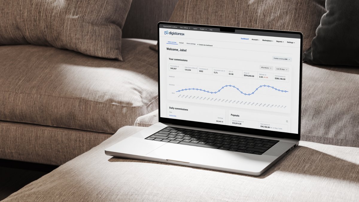 Laptop on a sofa displaying a Digistore24 dashboard.