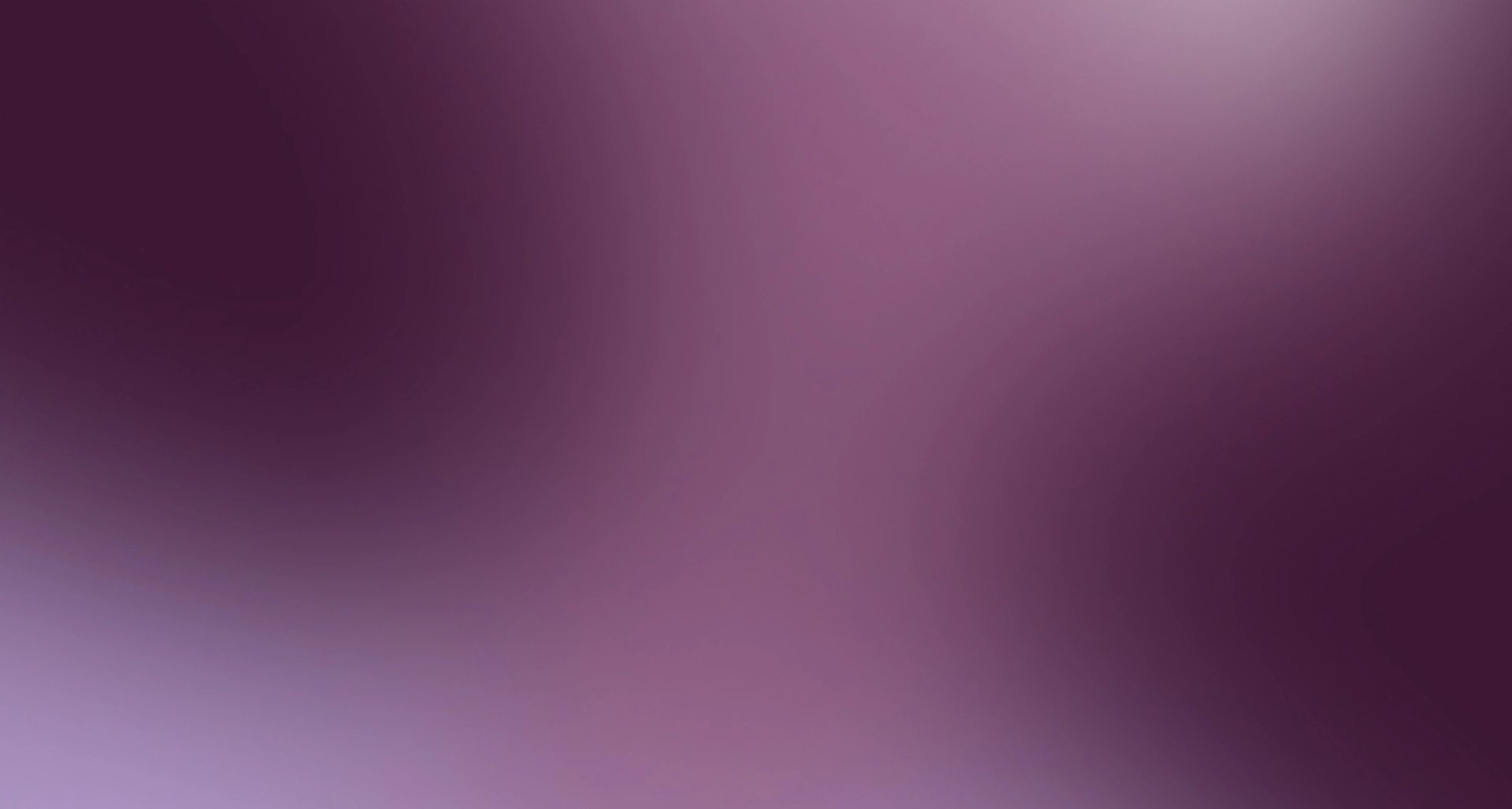 Blurred purple and maroon gradient background.