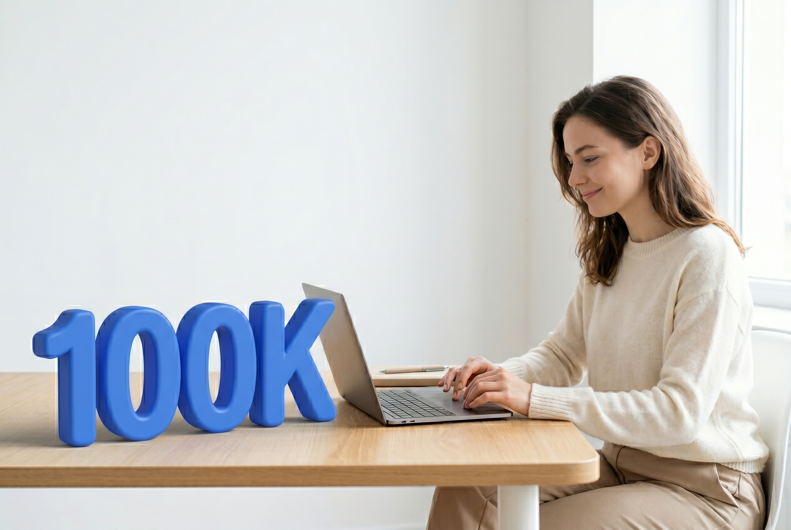 A smiling woman works on a laptop next to large blue 3D numbers reading "100K".