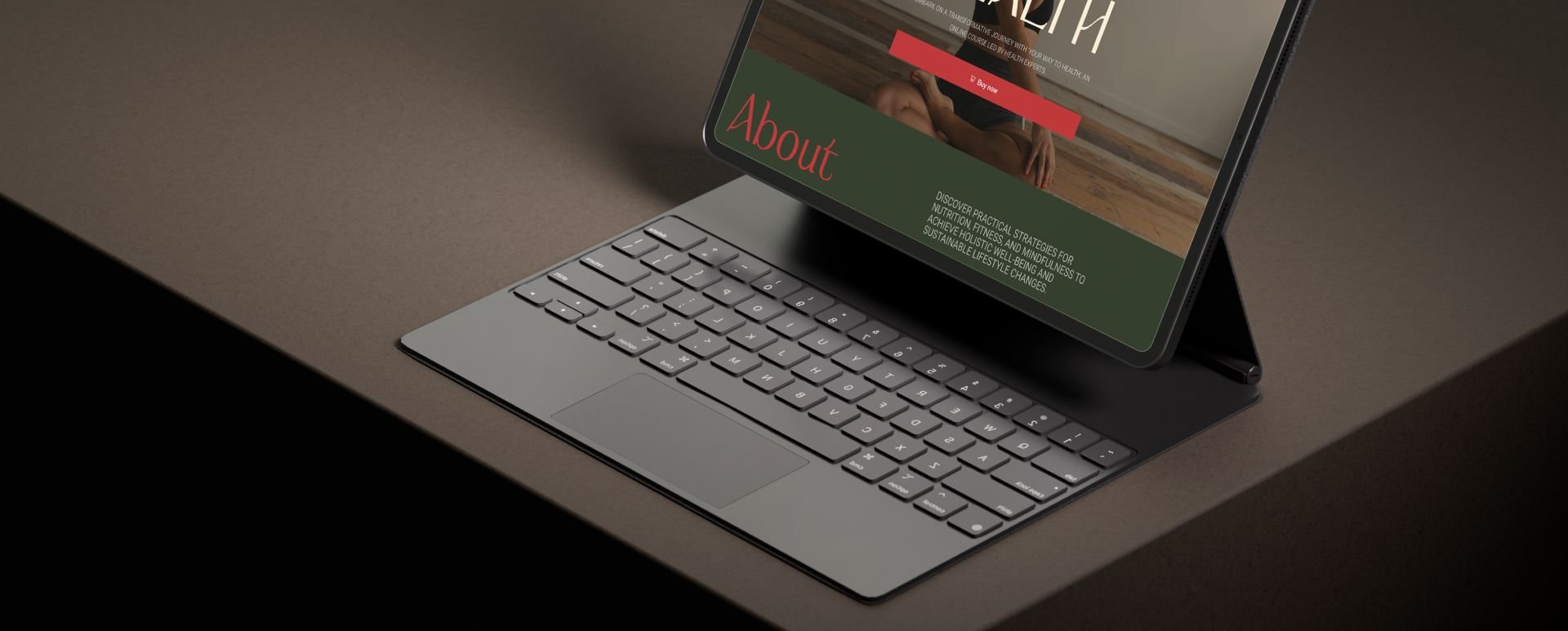 Tablet with a keyboard on a dark desk.