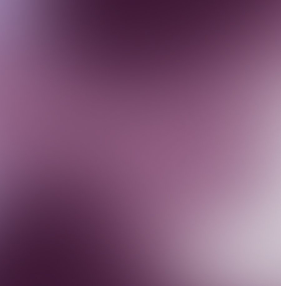 Blurred gradient background from dark purple to light purple.