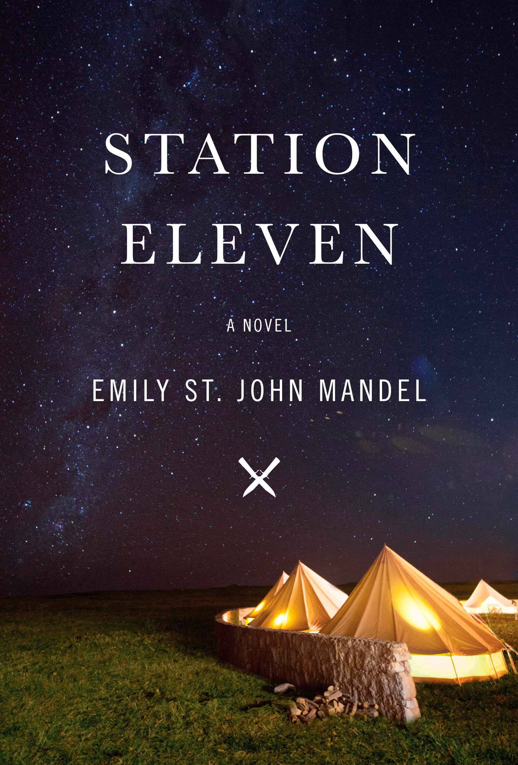 Book cover. Across the canvas is the title "Station Eleven" written in large white letters, while the author's name "Emily St. John Mandel" is written in smaller letters below. A grouping of yellow, cone-shaped tents fills the bottom of the canvas. They are lit up by lights inside. A dark, blue-black, star-sprangled sky can be seen above. 