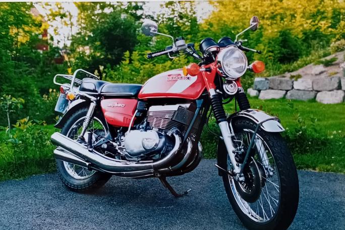 Classic blue Suzuki motorcycle