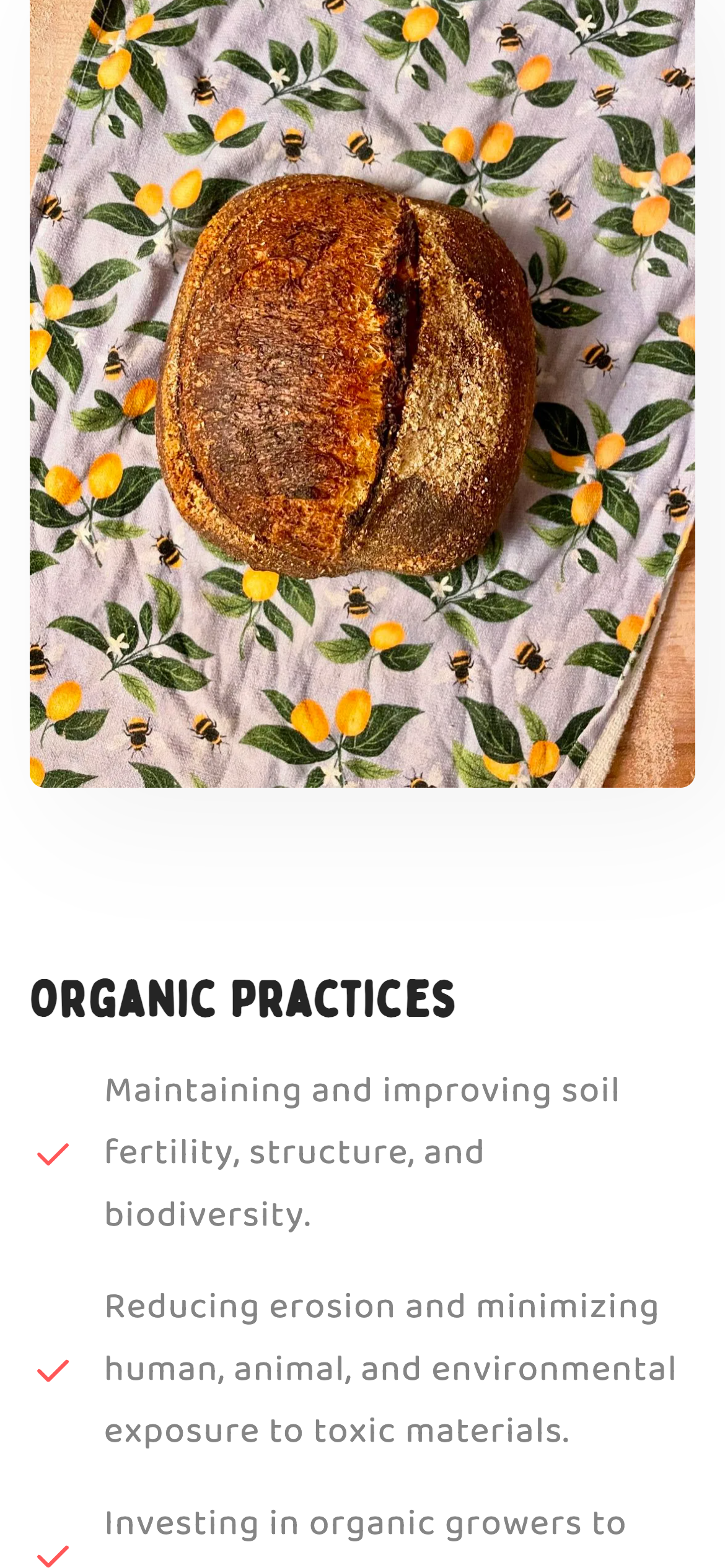 A loaf and the organic practices list on the Sourcing page, on a phone