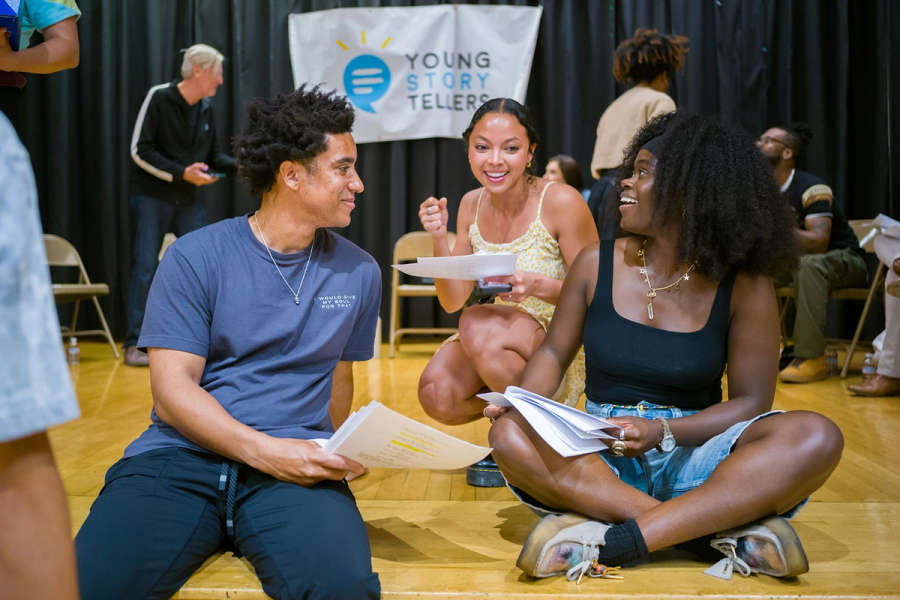 Actors preparing for a Big Show in a school auditorium