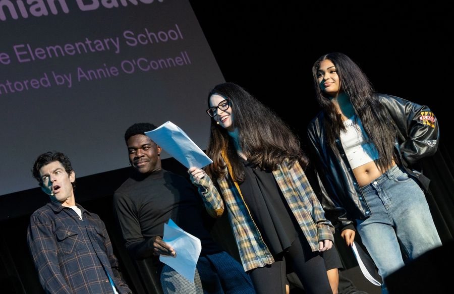 A group of actors performing on stage