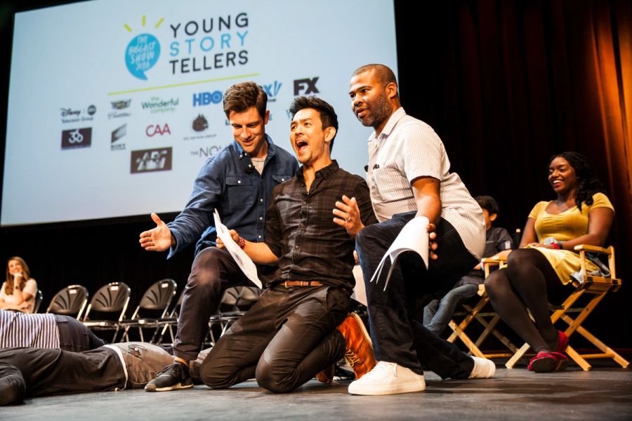 Three actors perform on stage