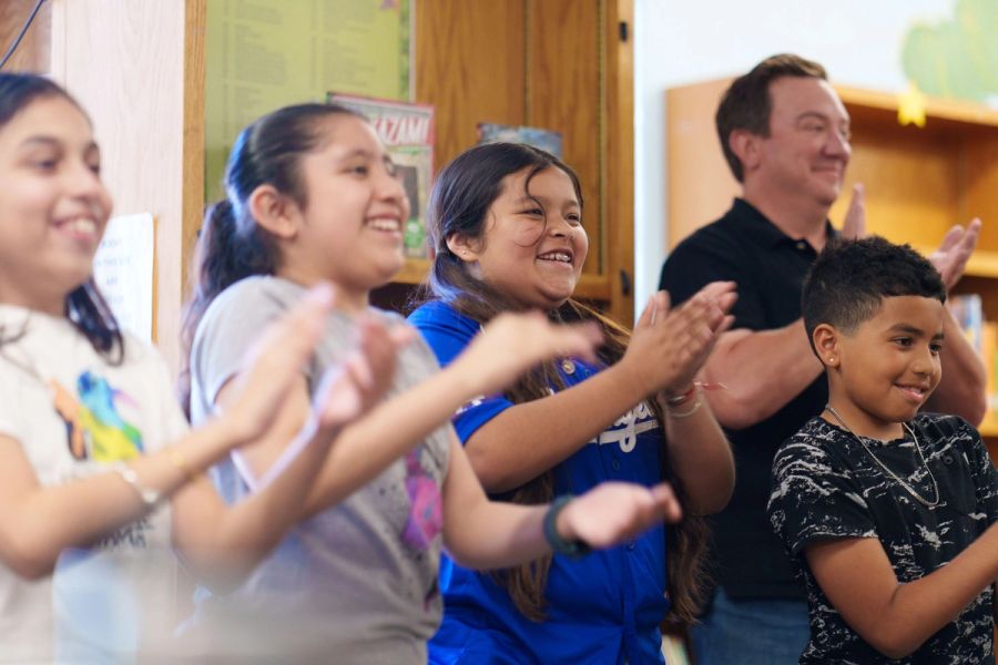 Young Storytellers students clapping
