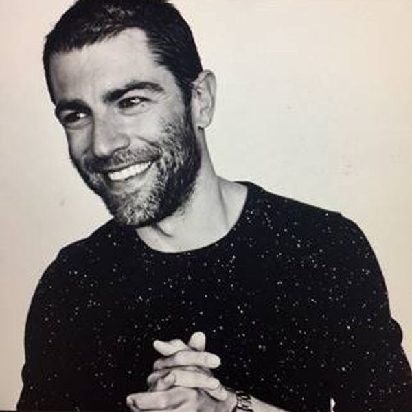Headshot of Max Greenfield