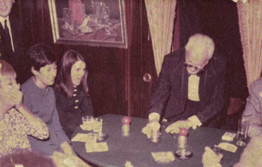 A vintage photo of a magician doing tricks