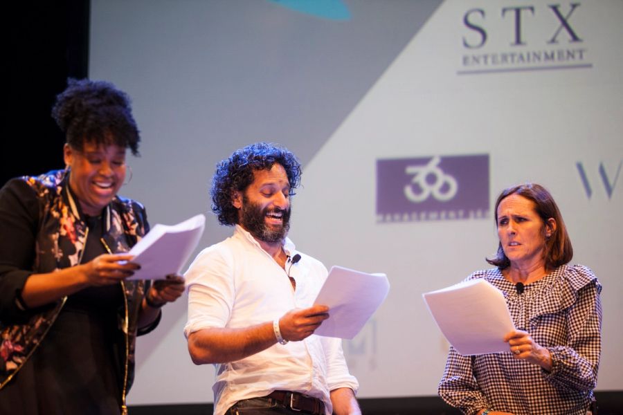 A group of actors perform on stage