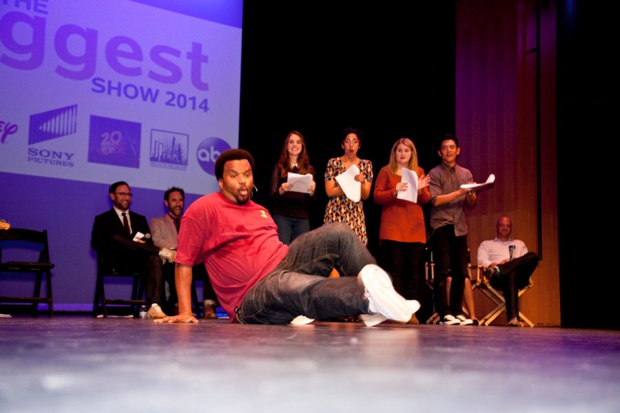 A group of actors perform on stage