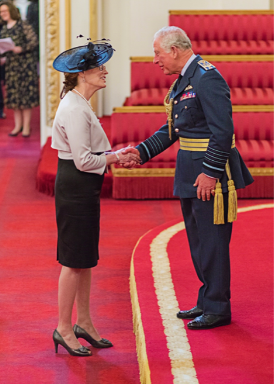 Shaking hands with the Commander of The Order of The British Empire