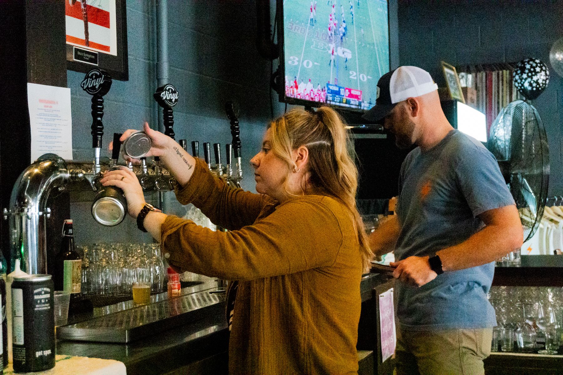Pouring beers during Vinyl Brewing's VinylMania event in 2021
