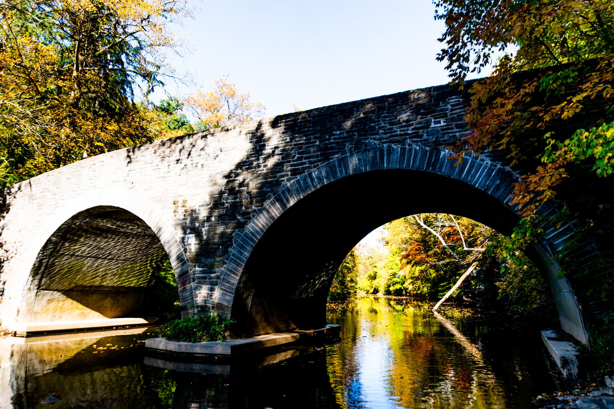 A closer view of the aqueduct footbridge as seen from the banks of the Wissahickon Creek.