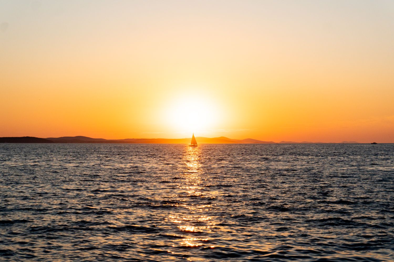 Sailboat at sunset in Zadar, Croatia