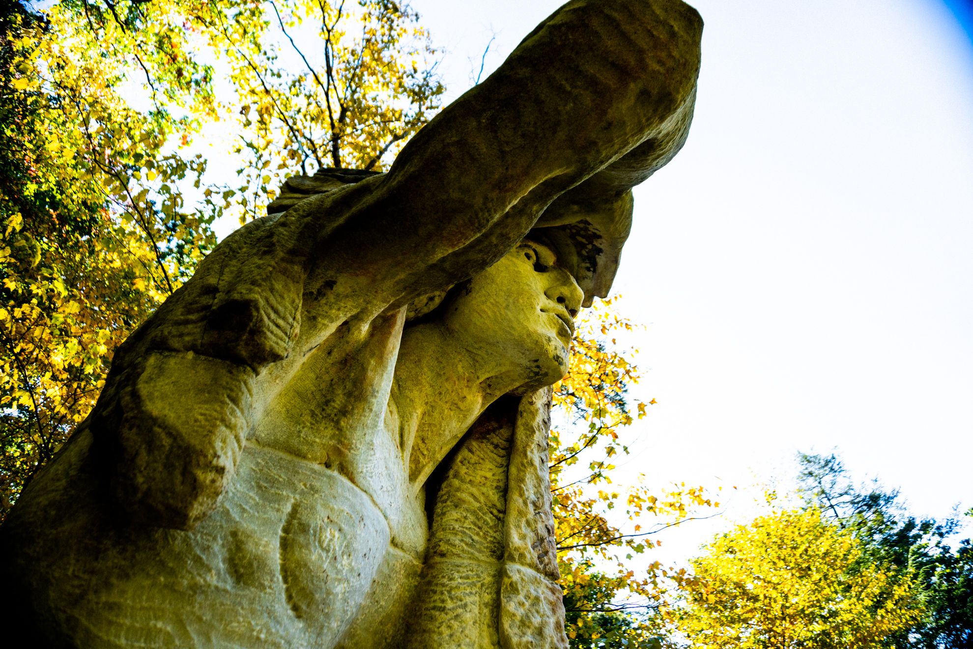 The statue of Teedyuscung seen from in front of the statue. The statue overlooks the Wissahickon Creek from atop a hill.