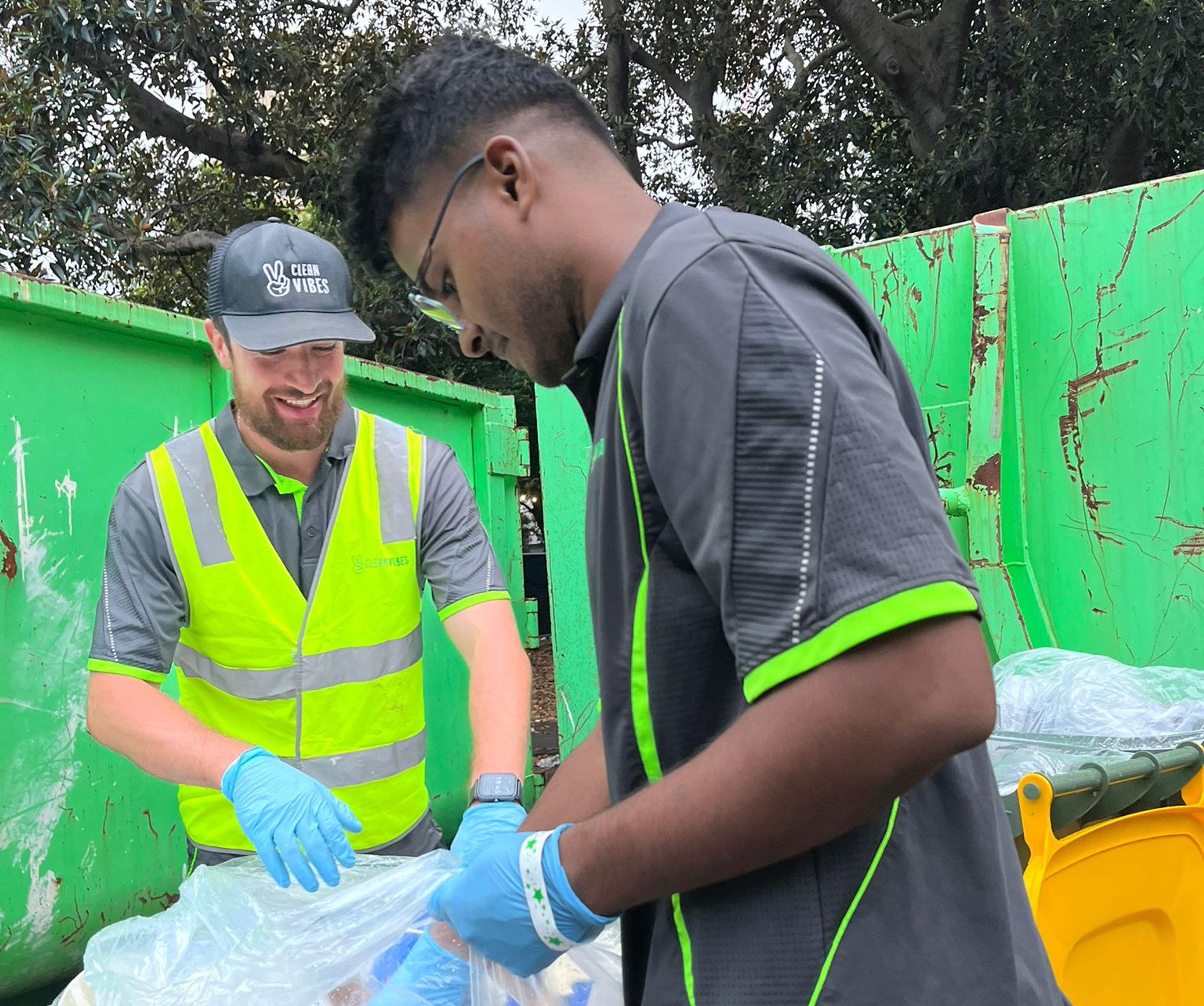 Clean Vibes staffs sorting recyclable items at compound