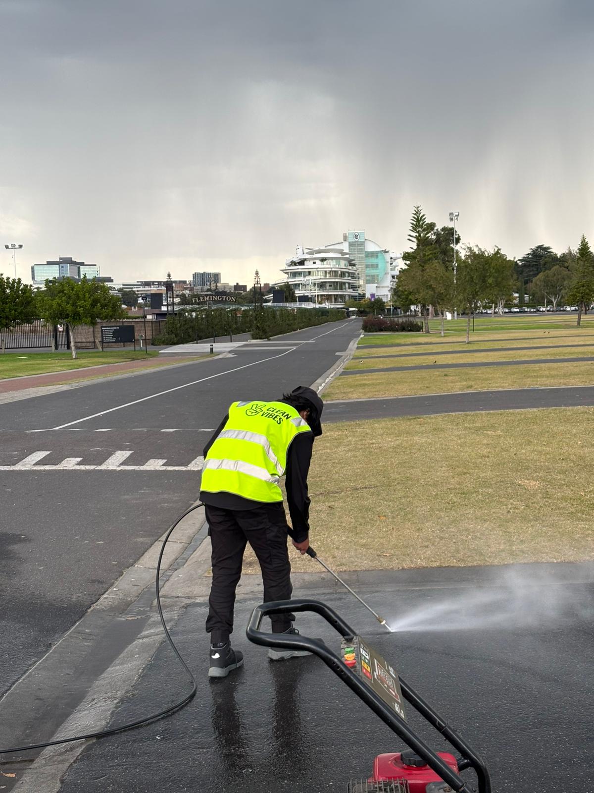 Clean Vibes staff member pressure washing 