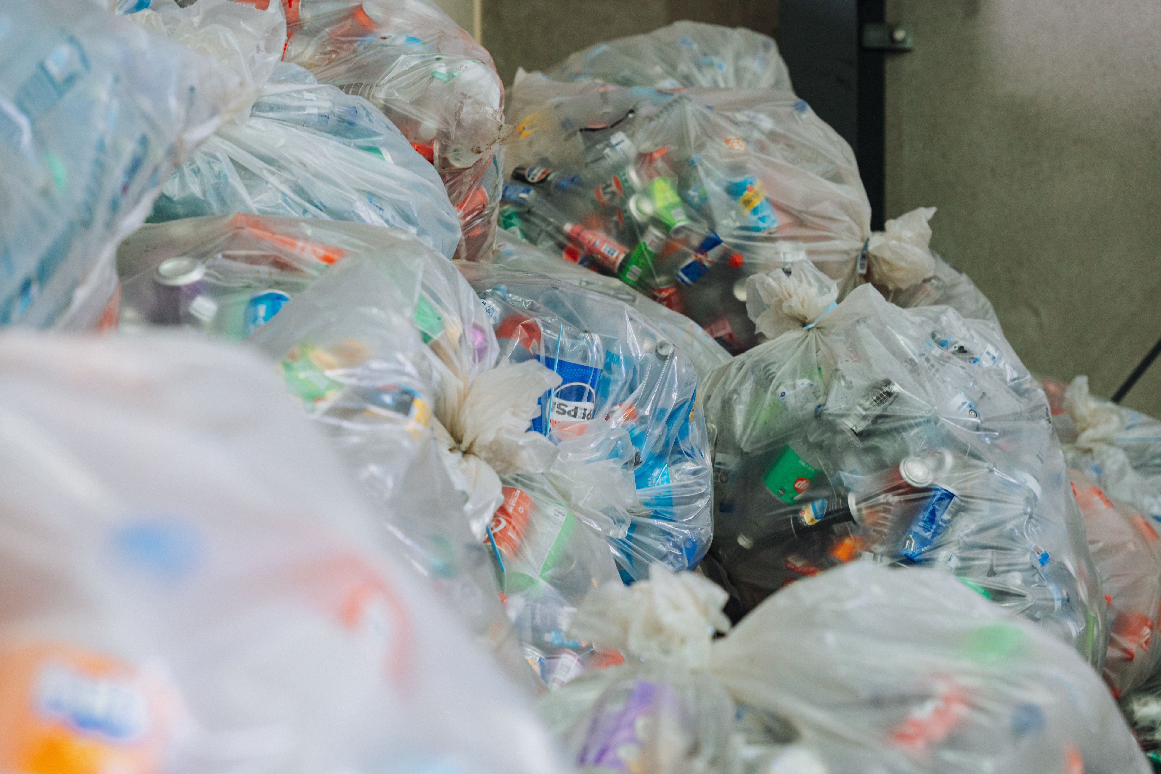 Bags full of empty cans and plastic bottles