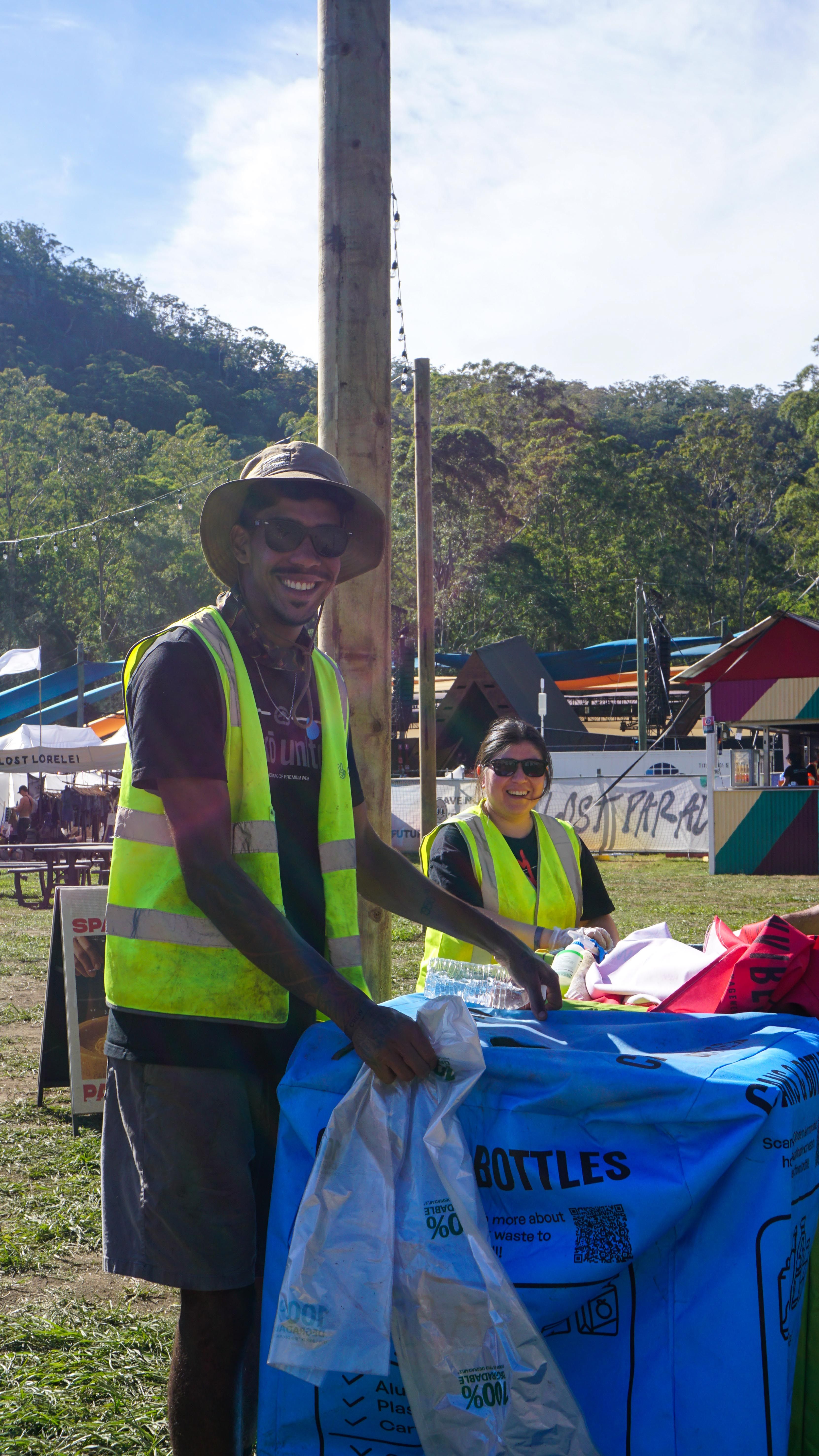 Clean Vibes employees changing bin's bag