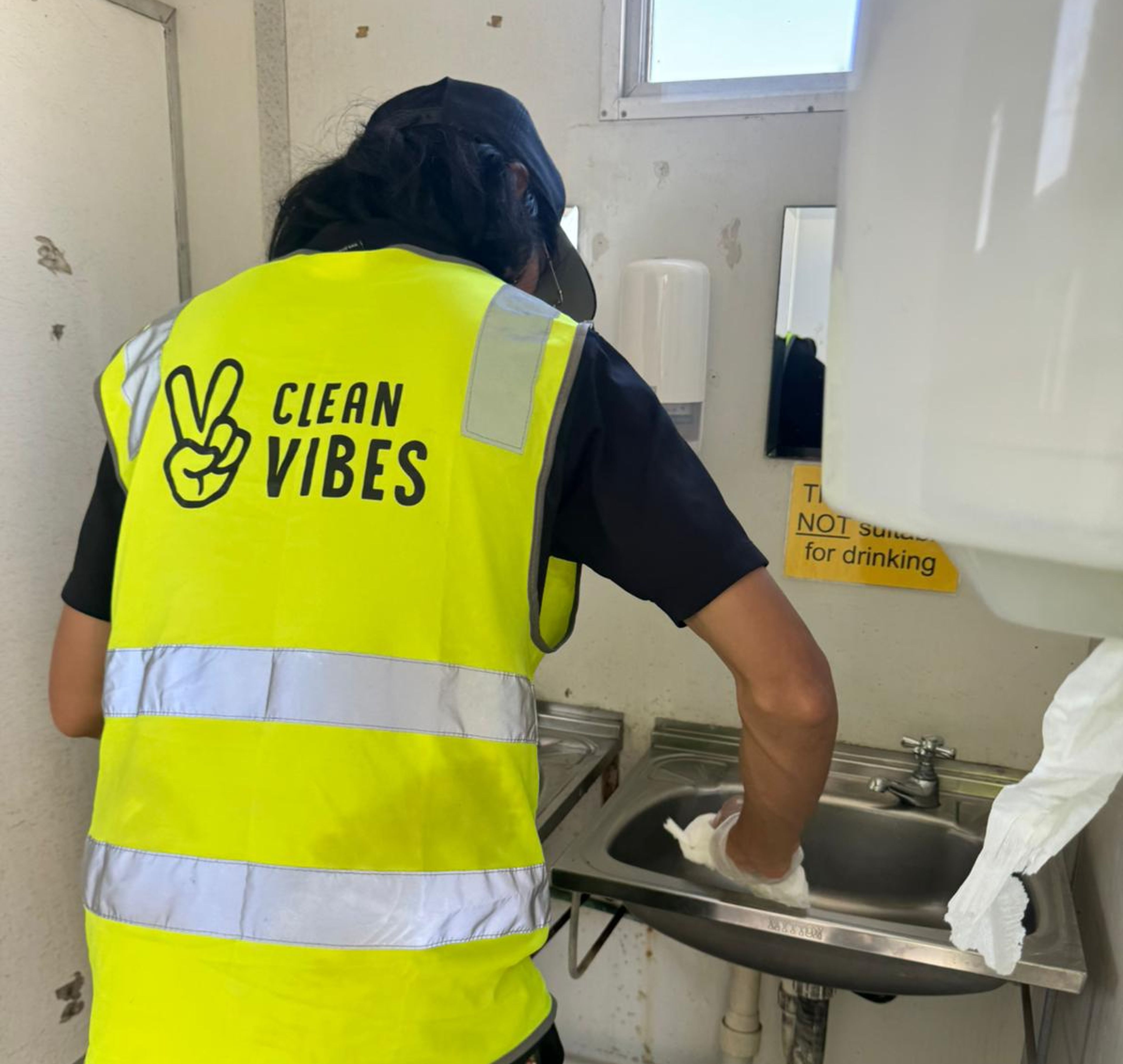 Clean Vibes staff cleaning back of house bathroom