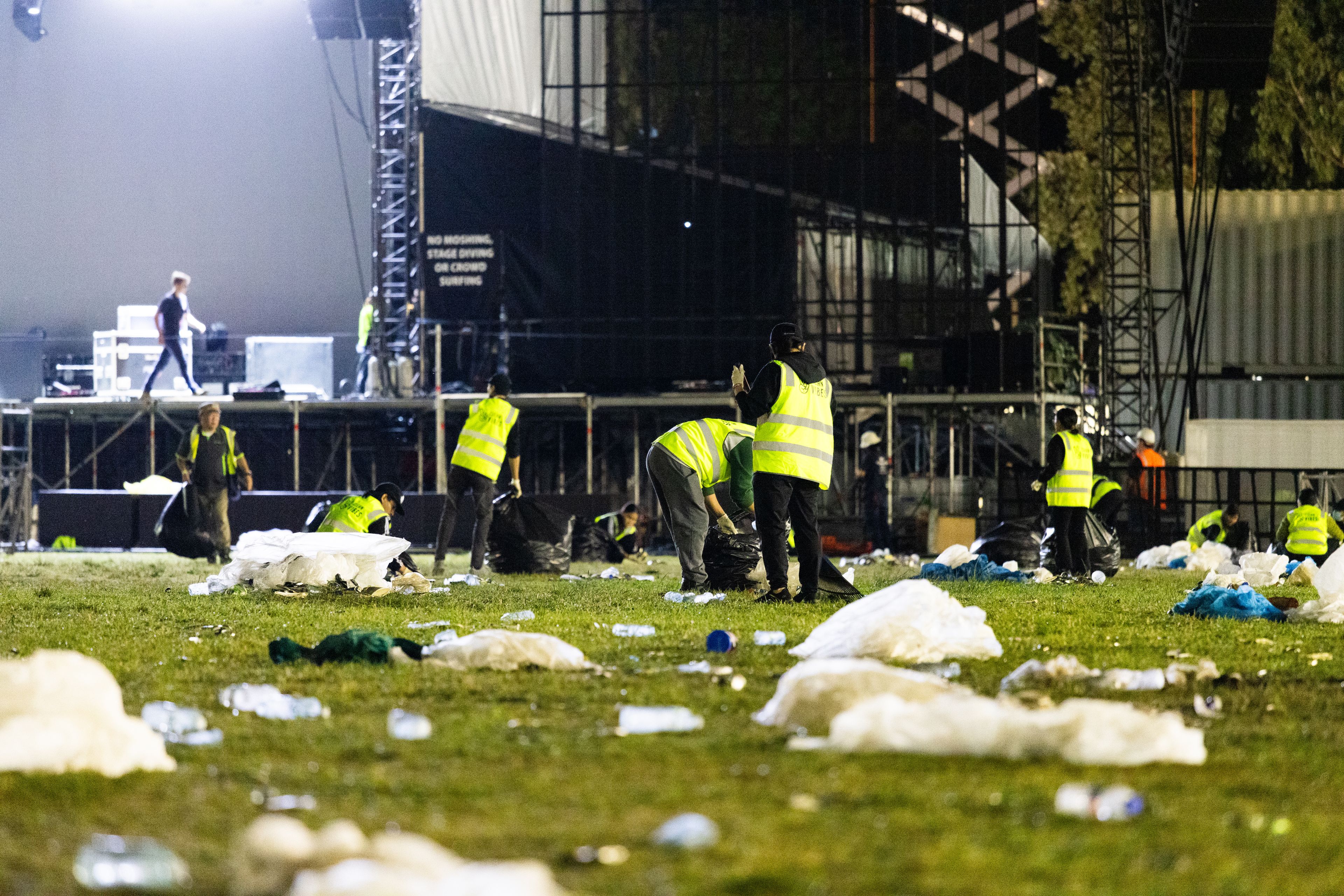 Clean Vibes casuals staffs cleaning the ground of the venue full of trashes