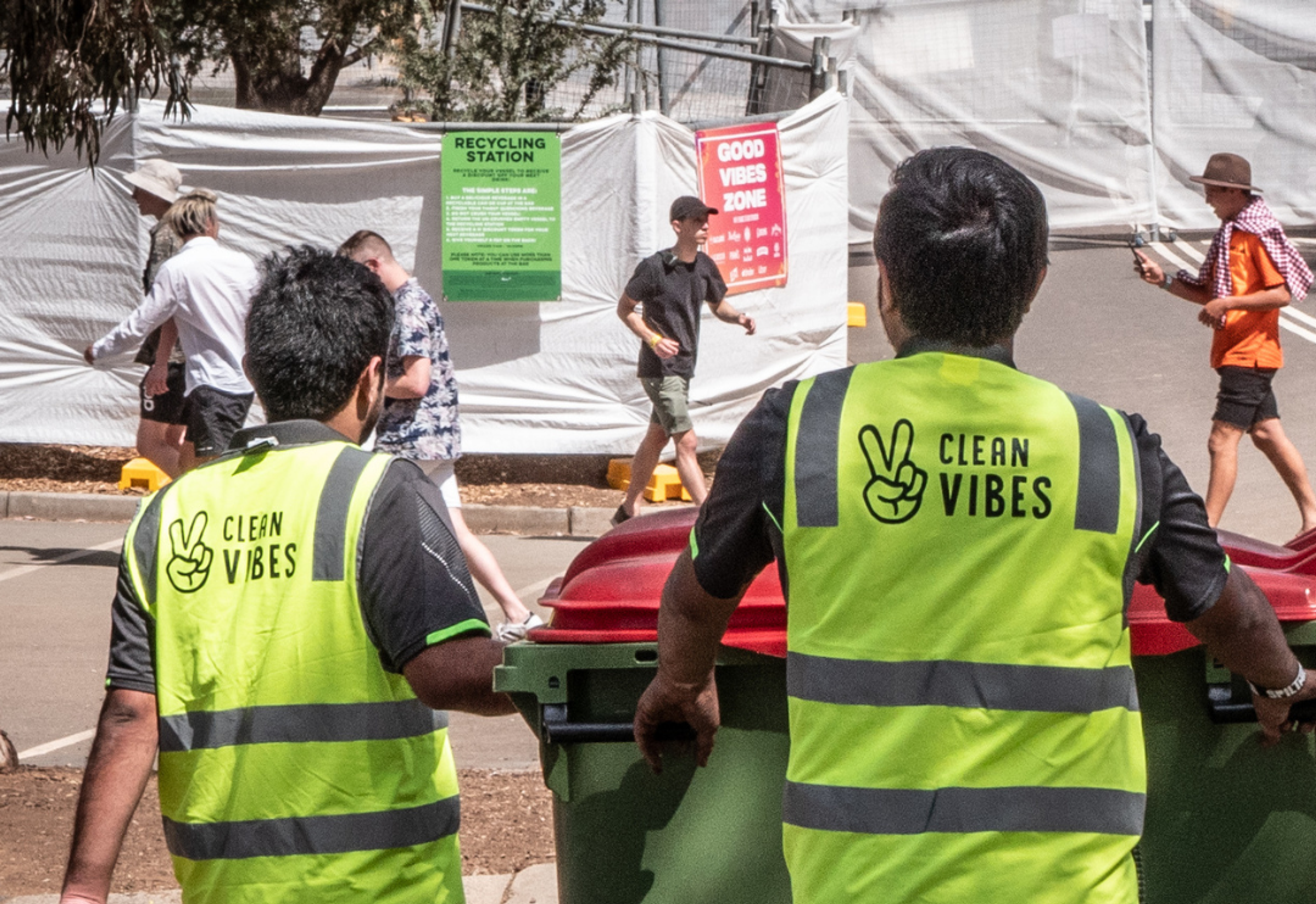 Clean Vibes staffs moving general waste bins around the event