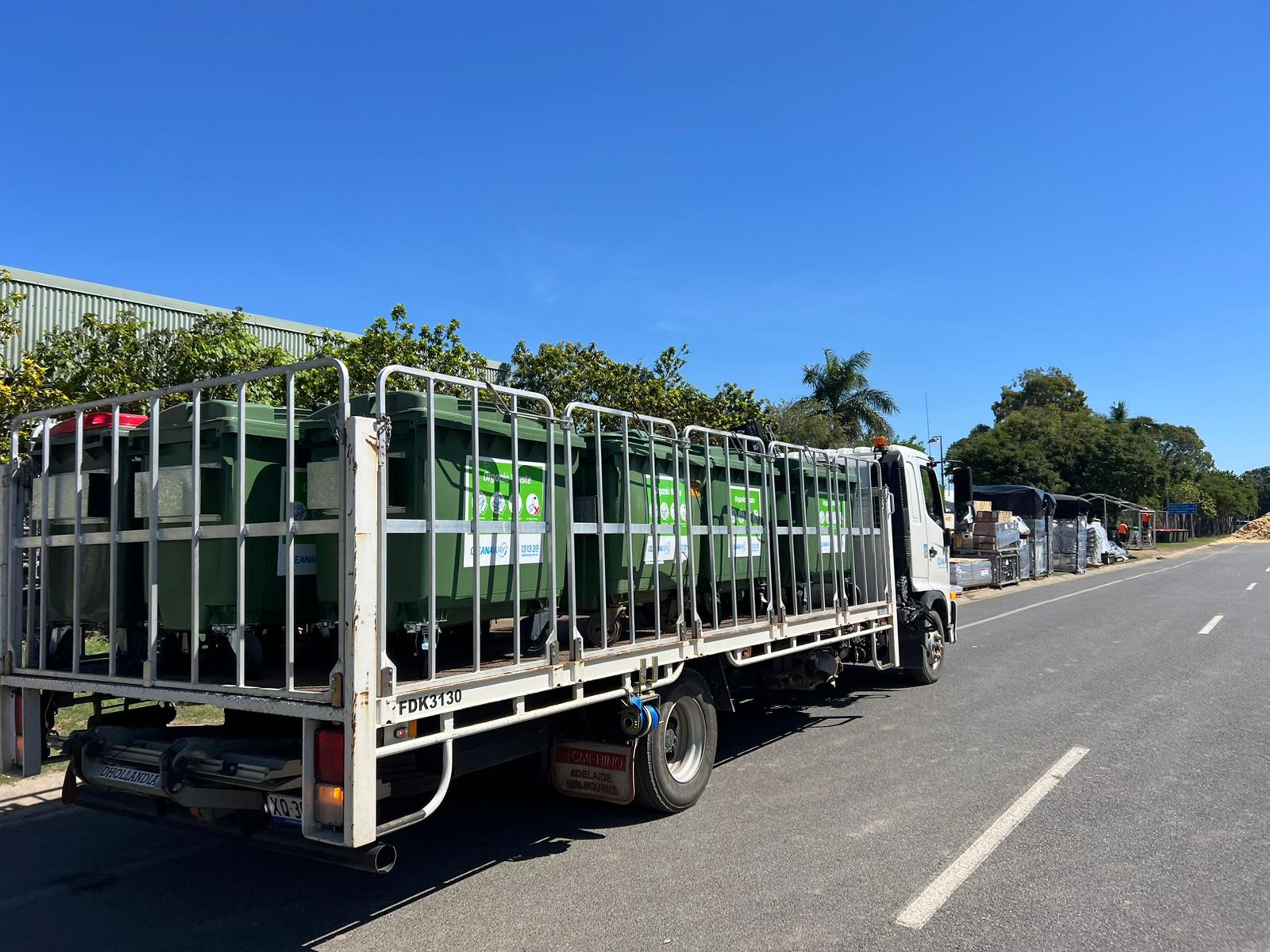 Clean Vibes truck carrying wheeling bin to an event 