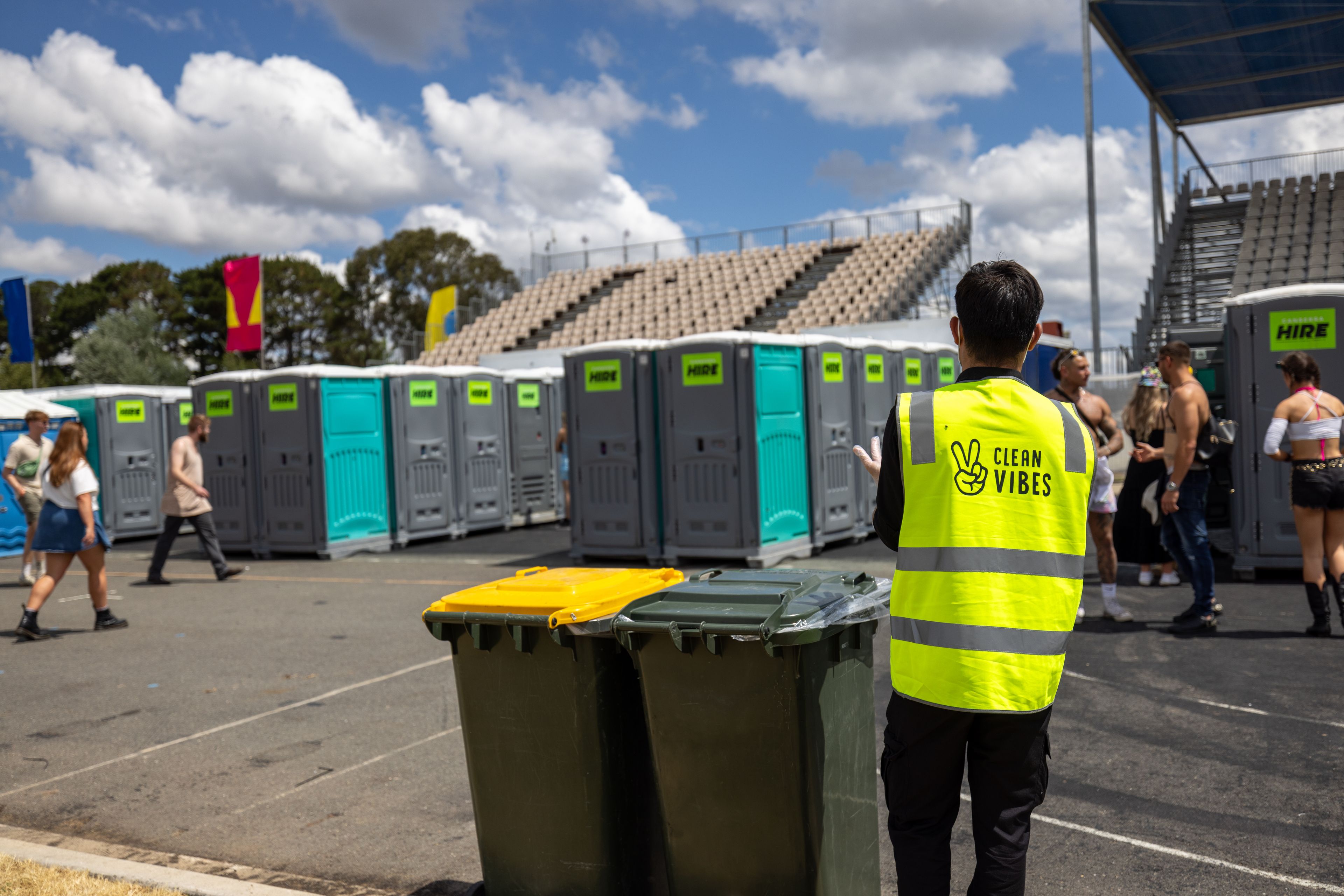 Clean Vibes staff in front of festival's toilets