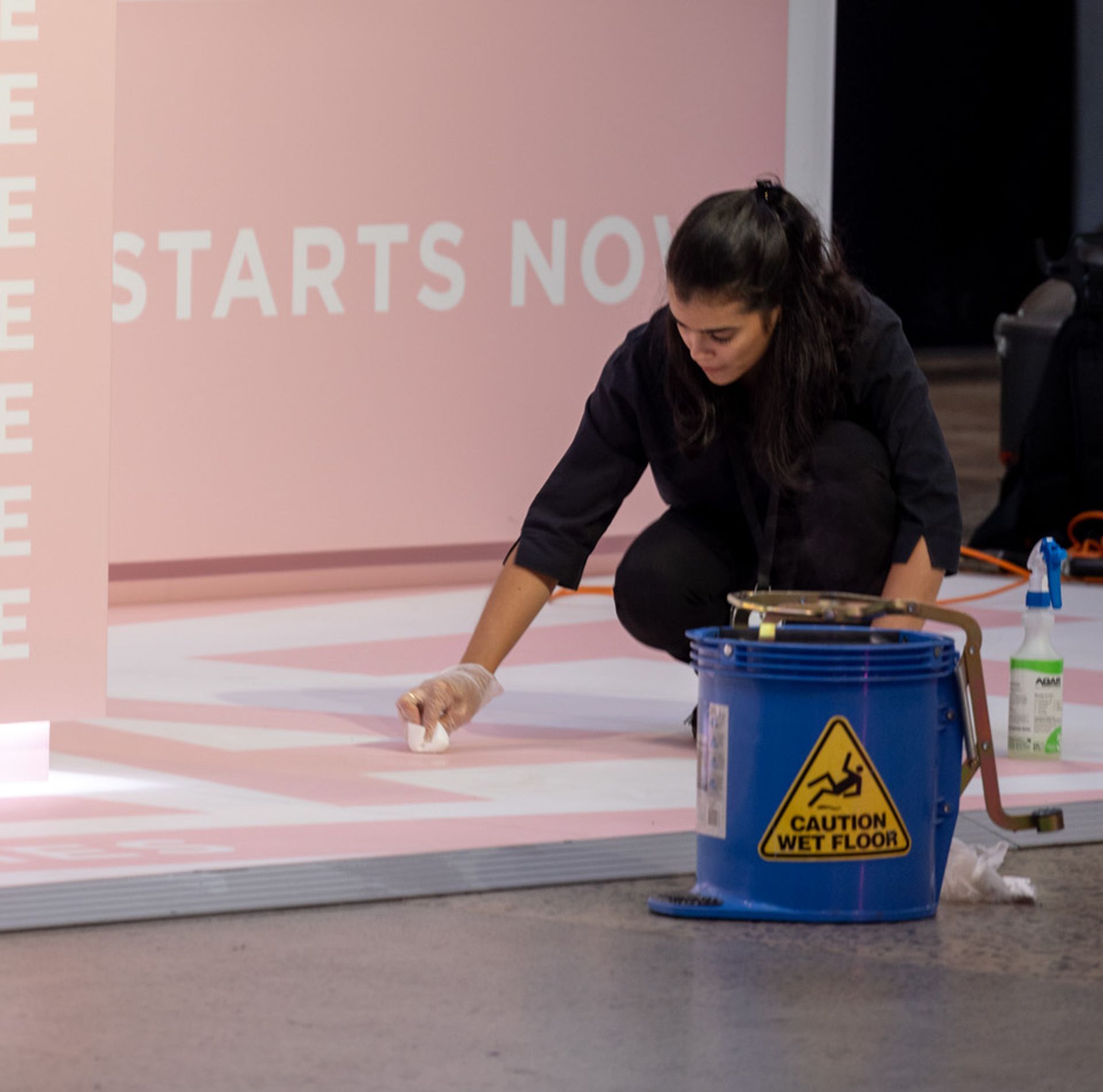 Clean Vibes staff cleaning stains on the floor