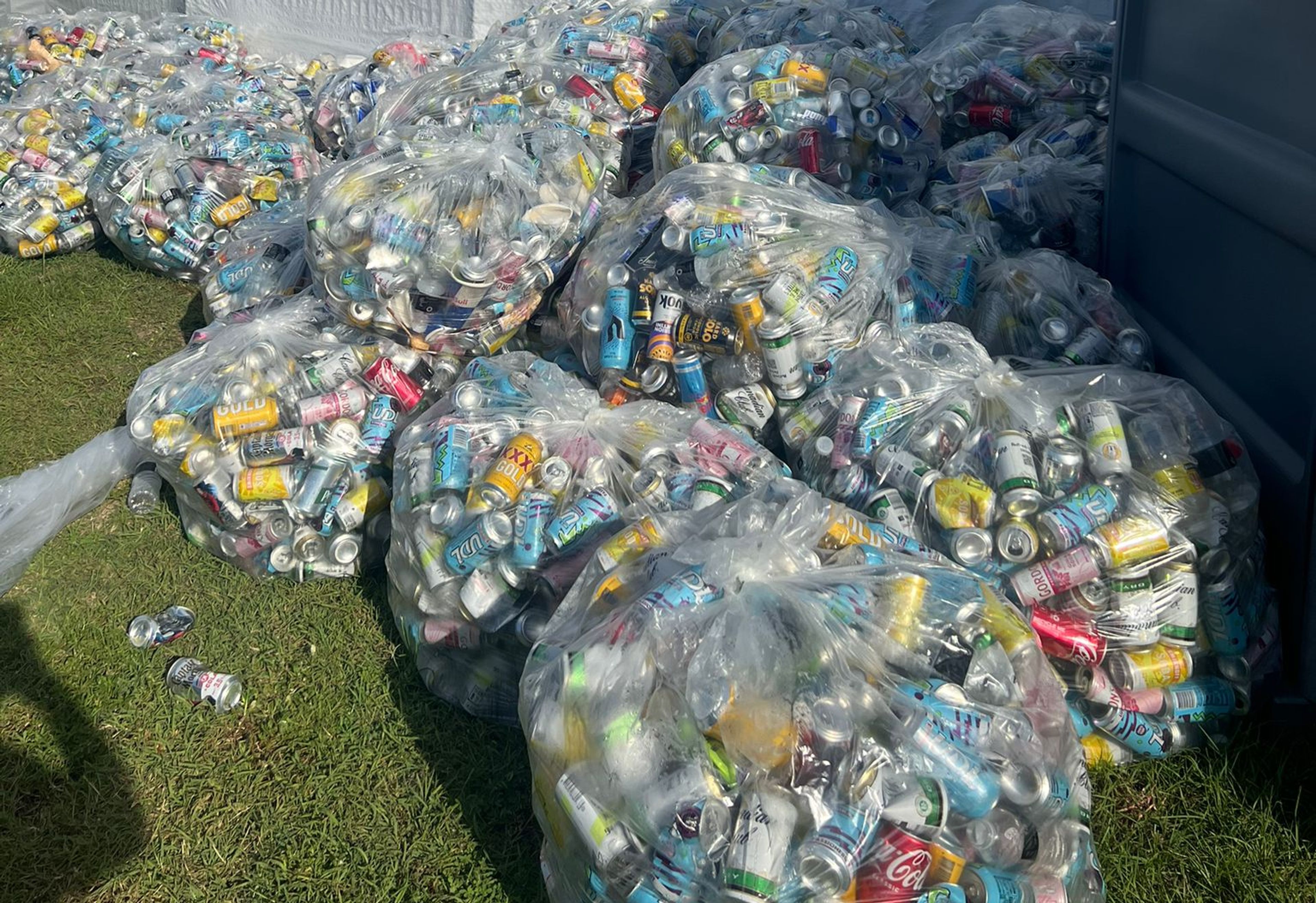 Bags full of empty cans ready to be recycled