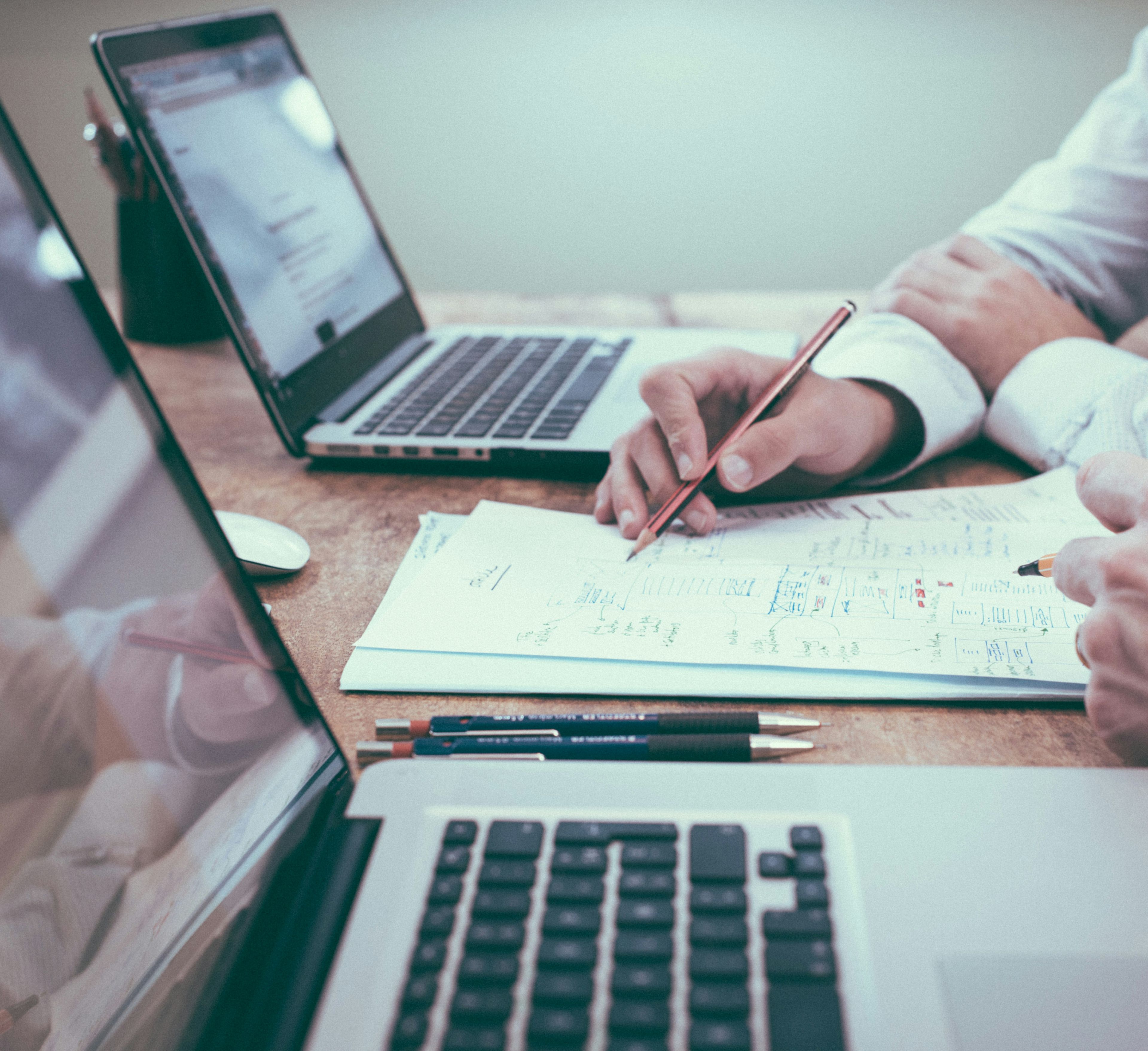 Clean Vibes team in meeting working on laptops