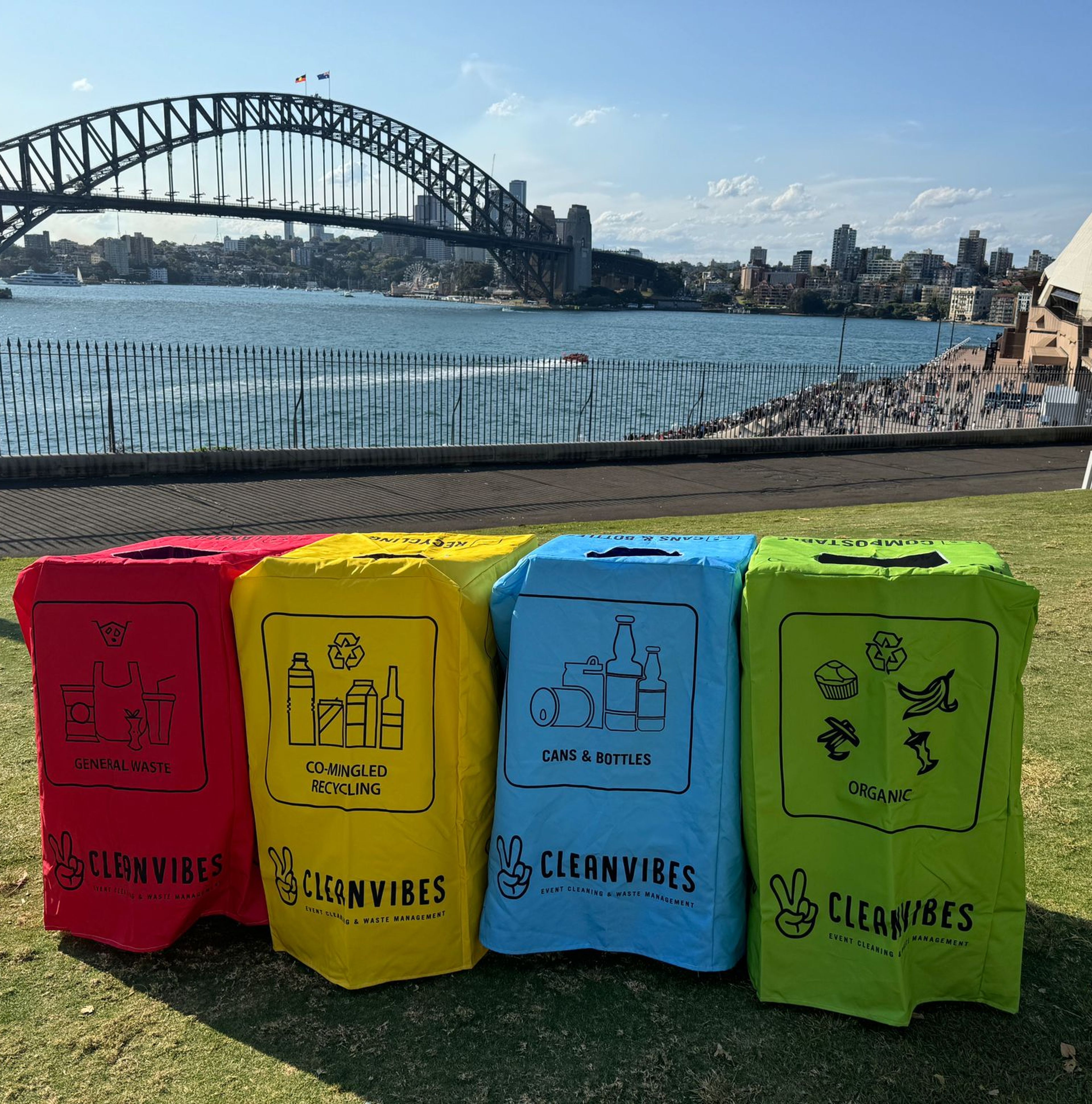 Clean Vibes set of fourth bins with covers in front of the Sydney Harbour Bridge