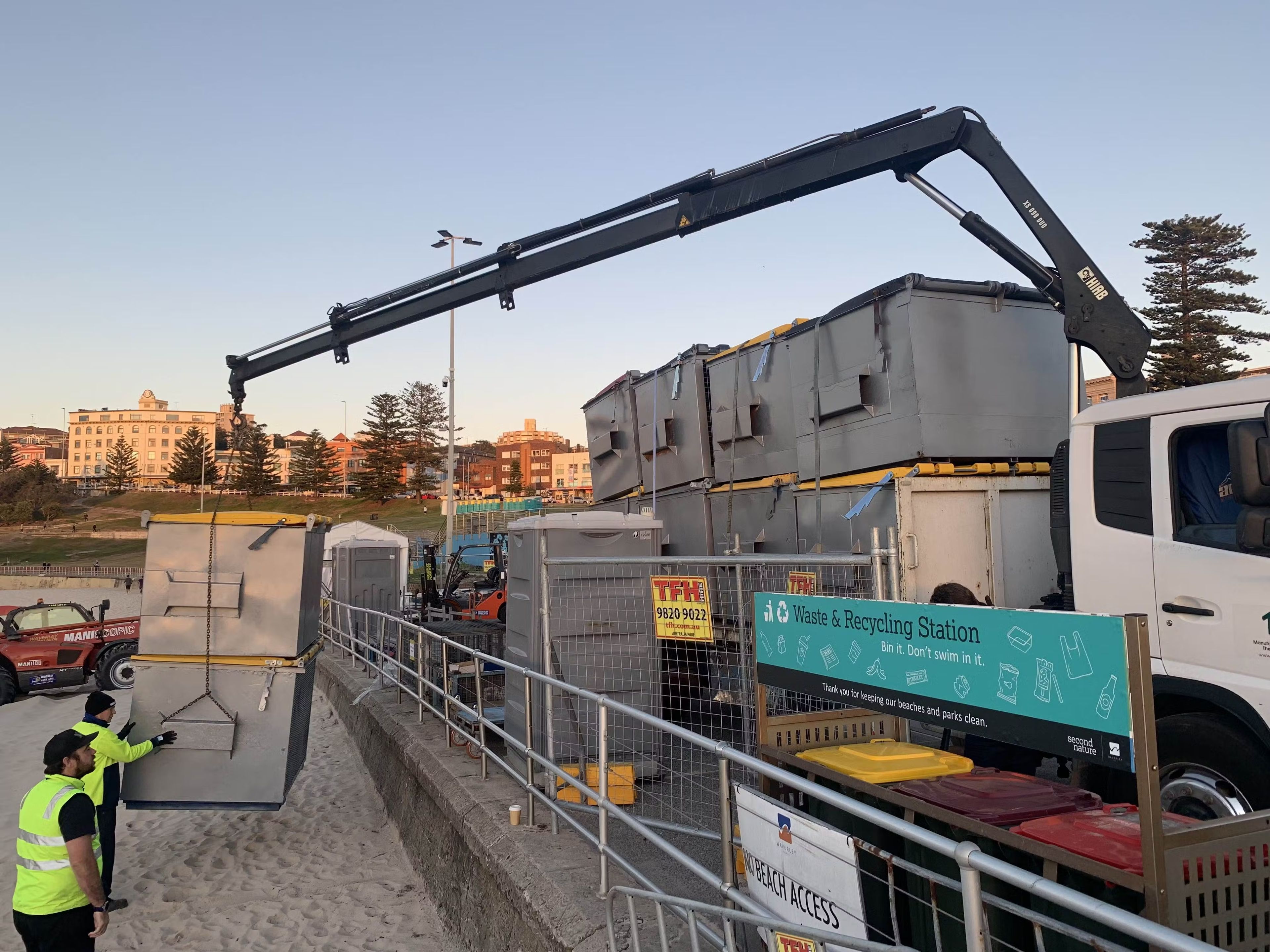 Clean Vibes truck at Bondi beach unloading skips bins