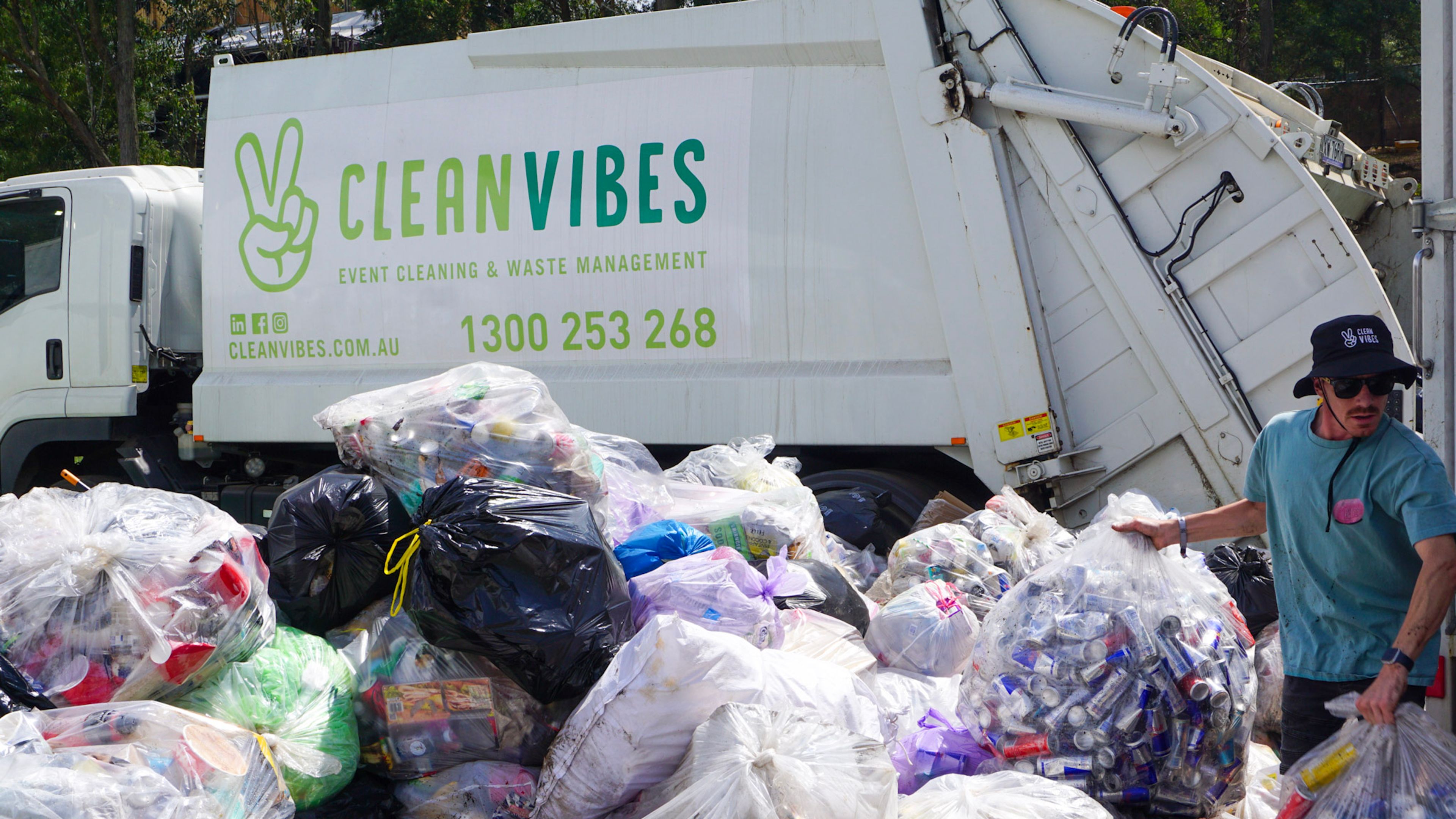 Clean Vibes truck next to bags of recyclable containers