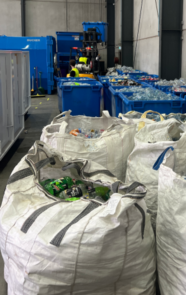 City Return and Earn bags full of empty containers ready to be recycled