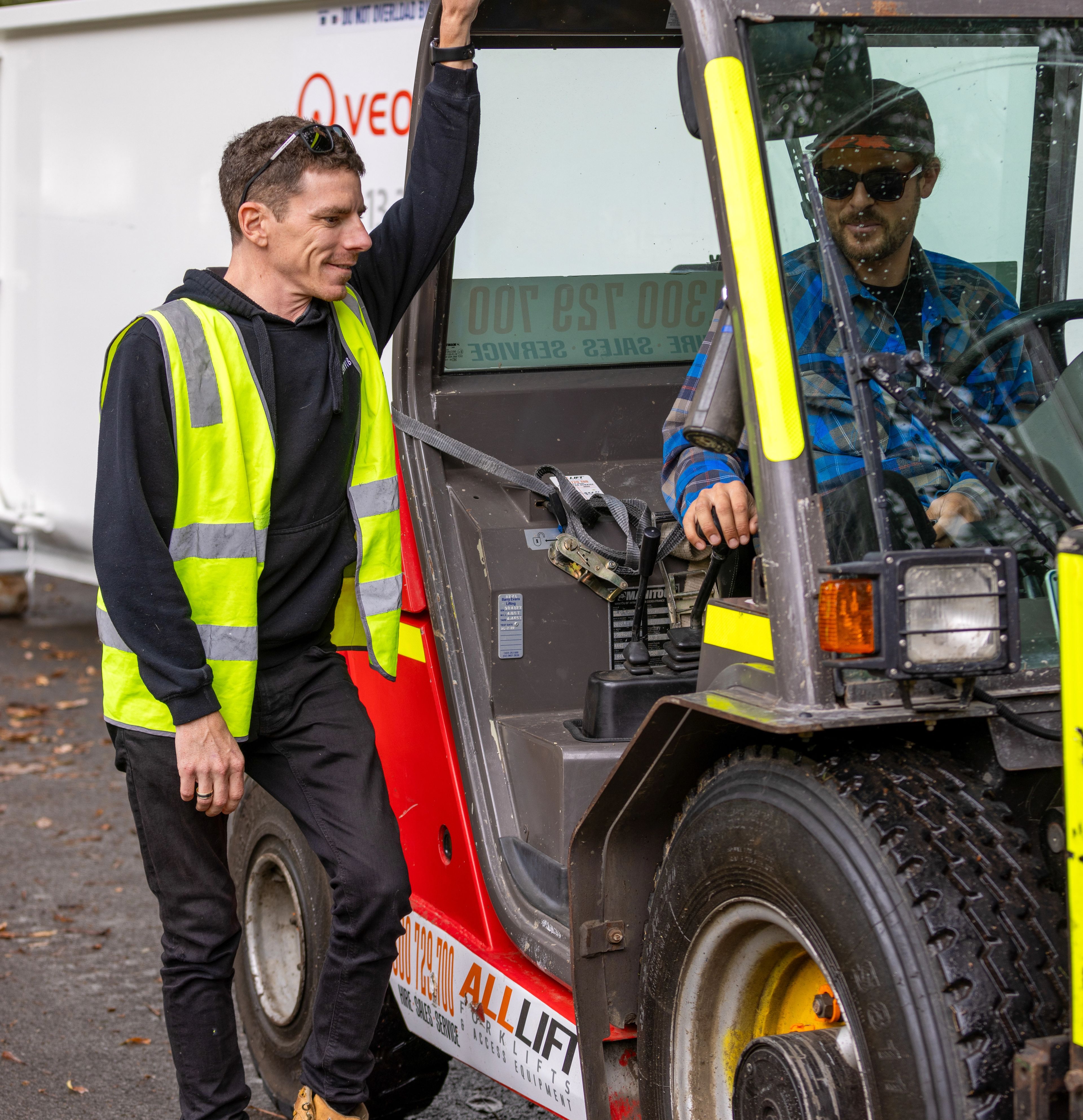 staff next to forklift