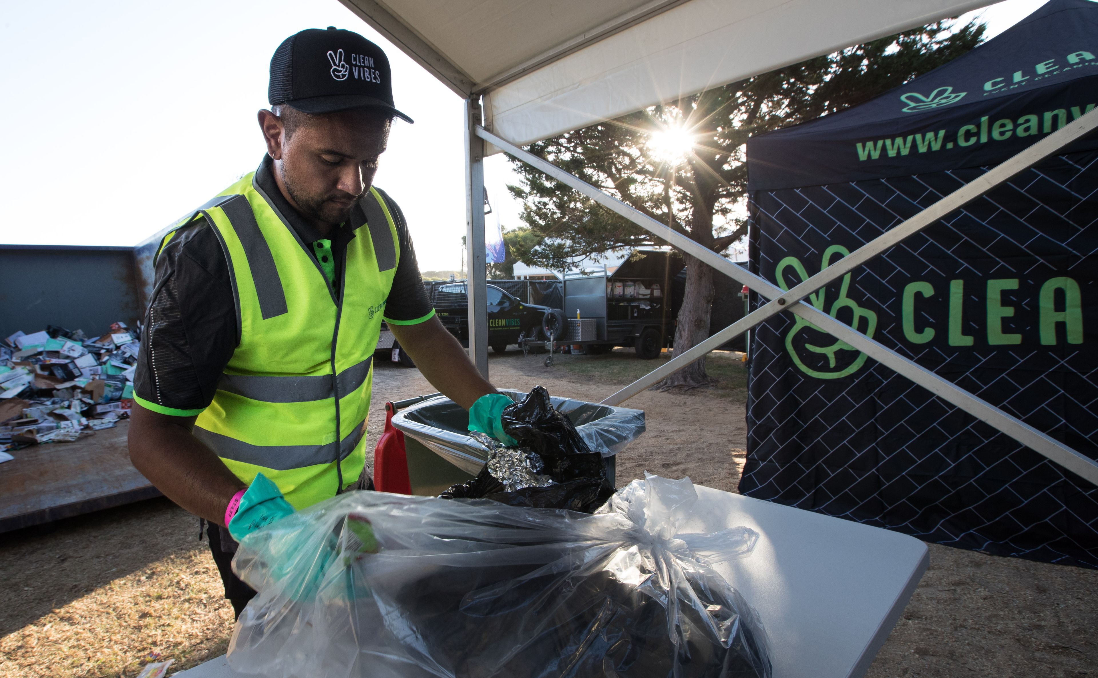 Clean Vibes staff replacing a bin bag at event
