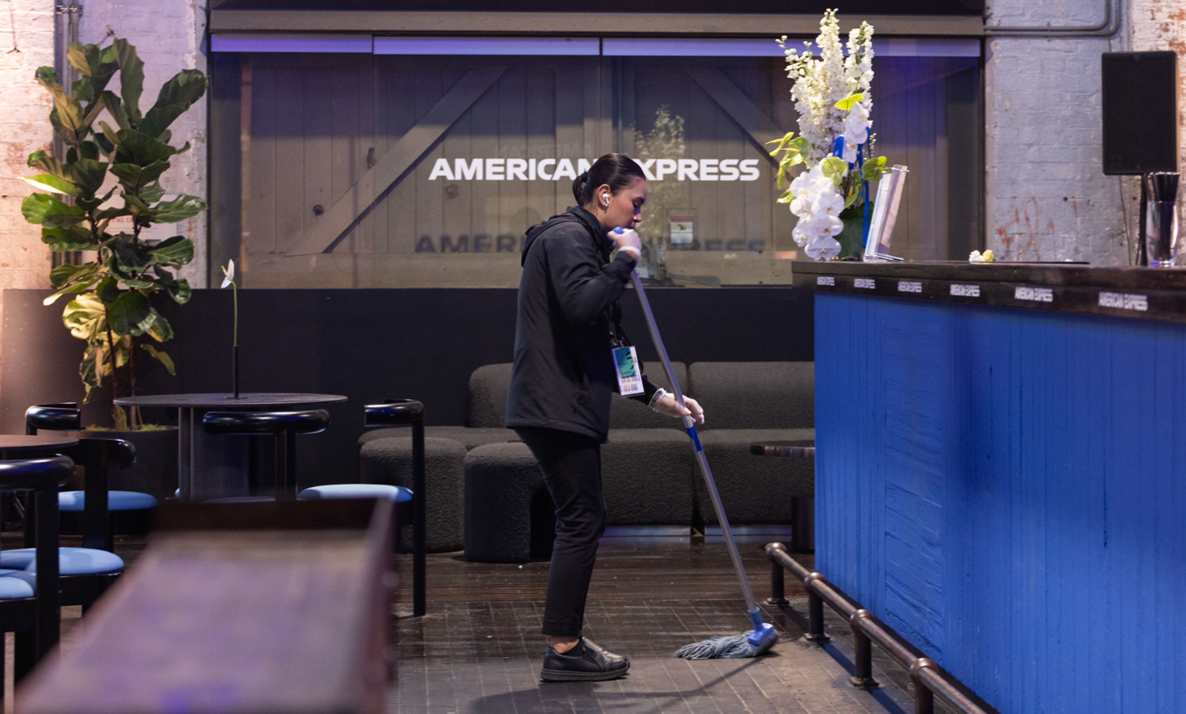 Clean Vibes employee cleaning the American Express Bar at Sydney Fashion Week 2024