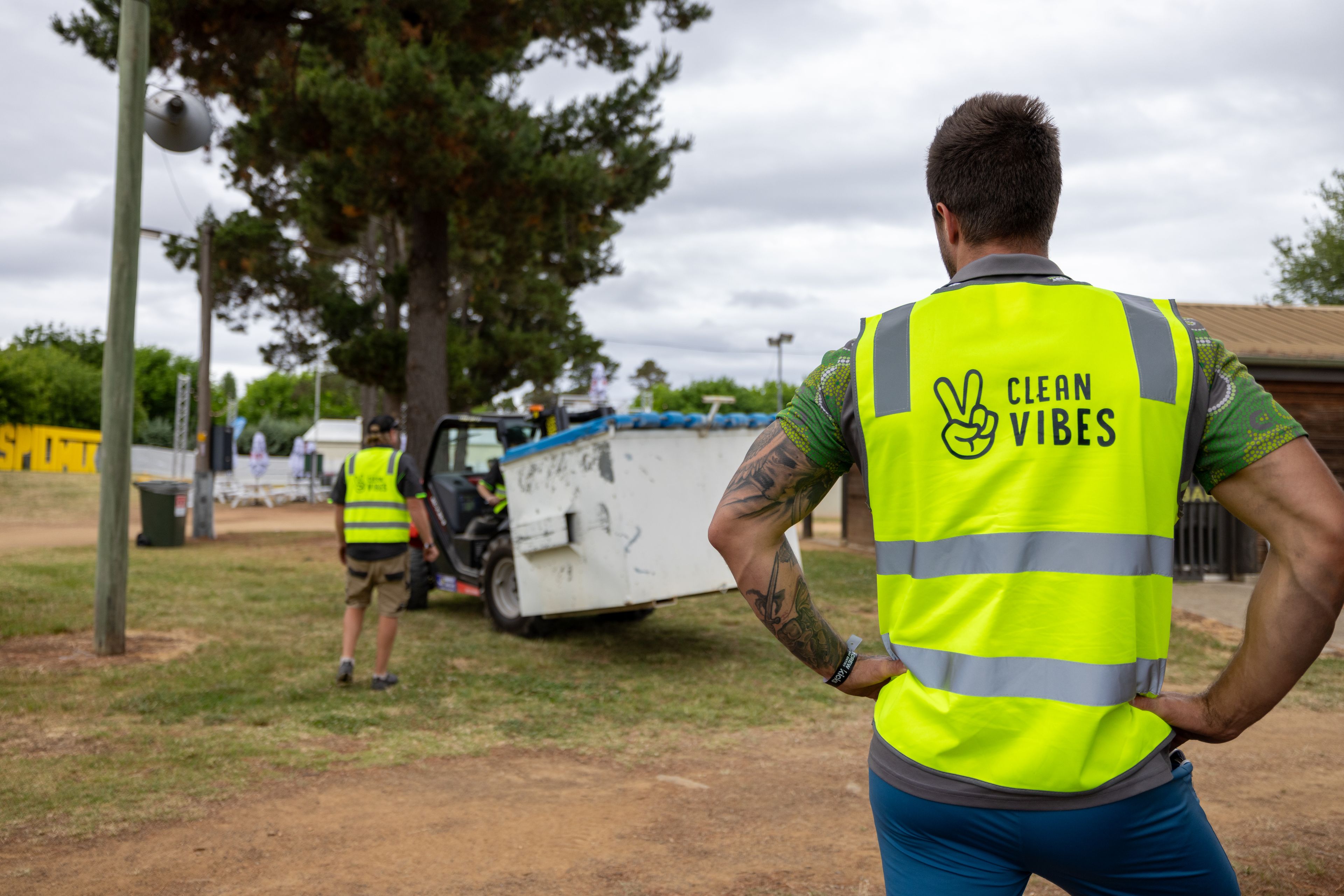 Clean Vibes staffs moving container around the event