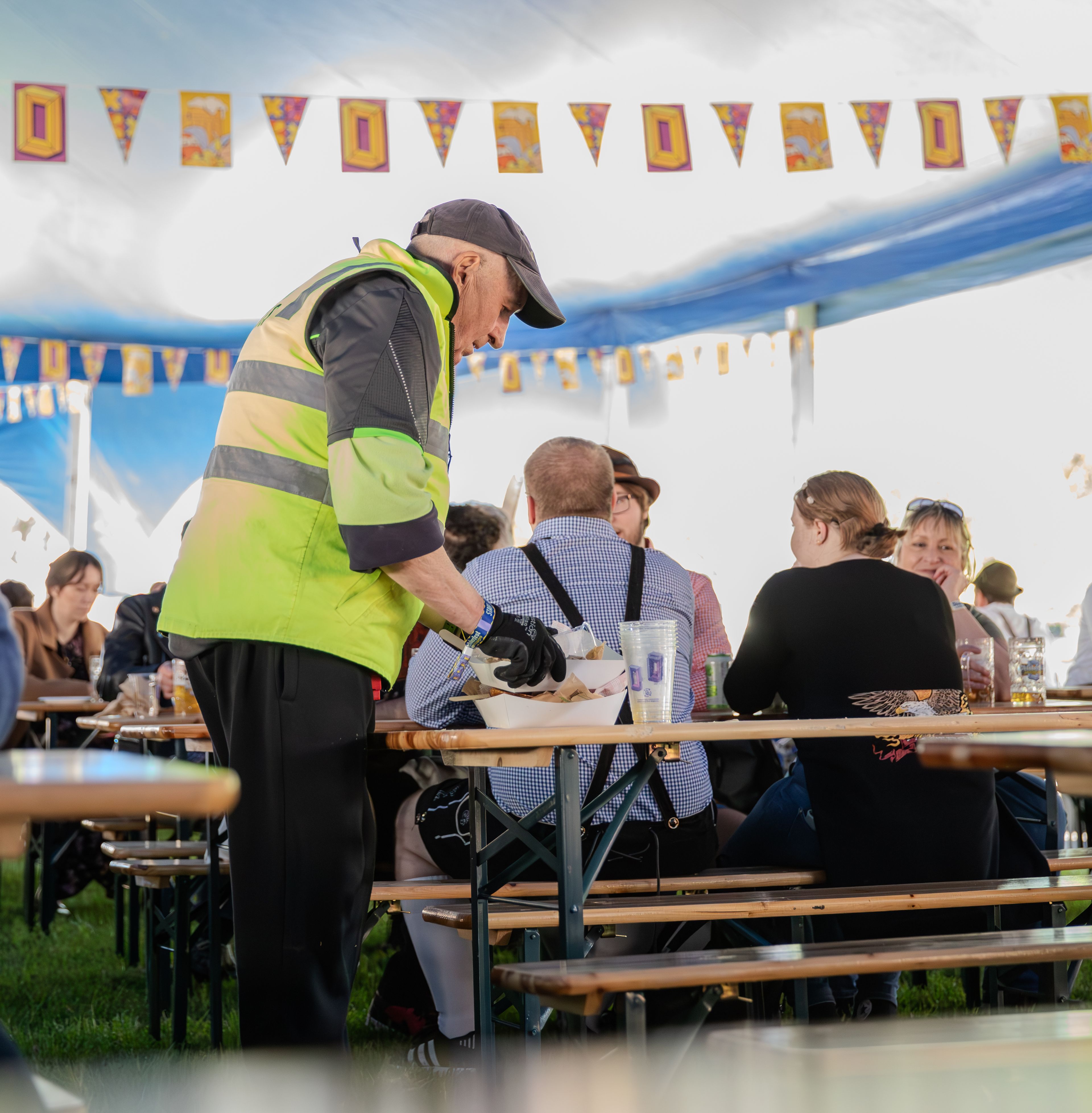 Clean Vibes staff cleaning tables removing food takeaway boxes