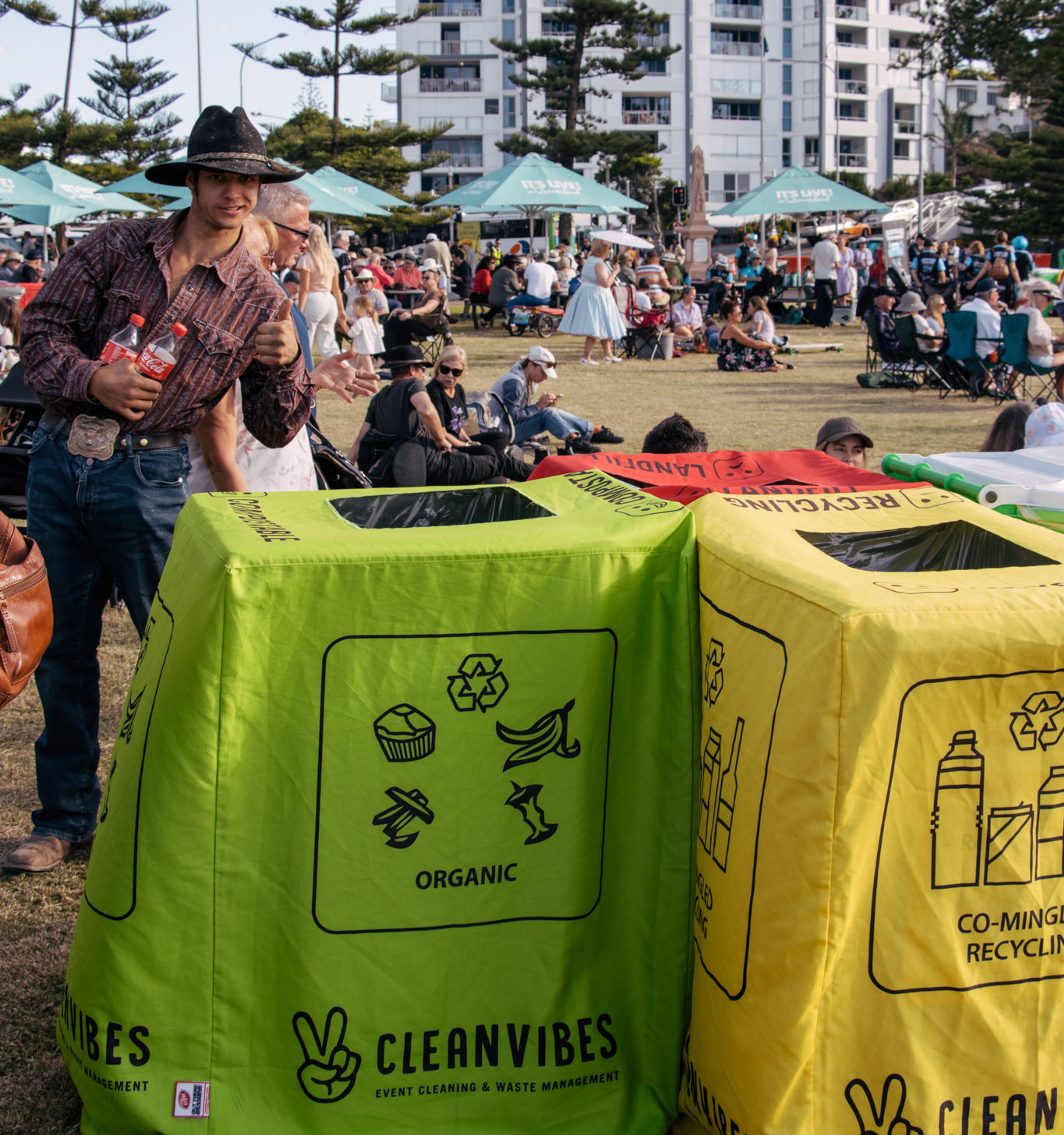 Clean Vibes bins displayed at event with patrons around