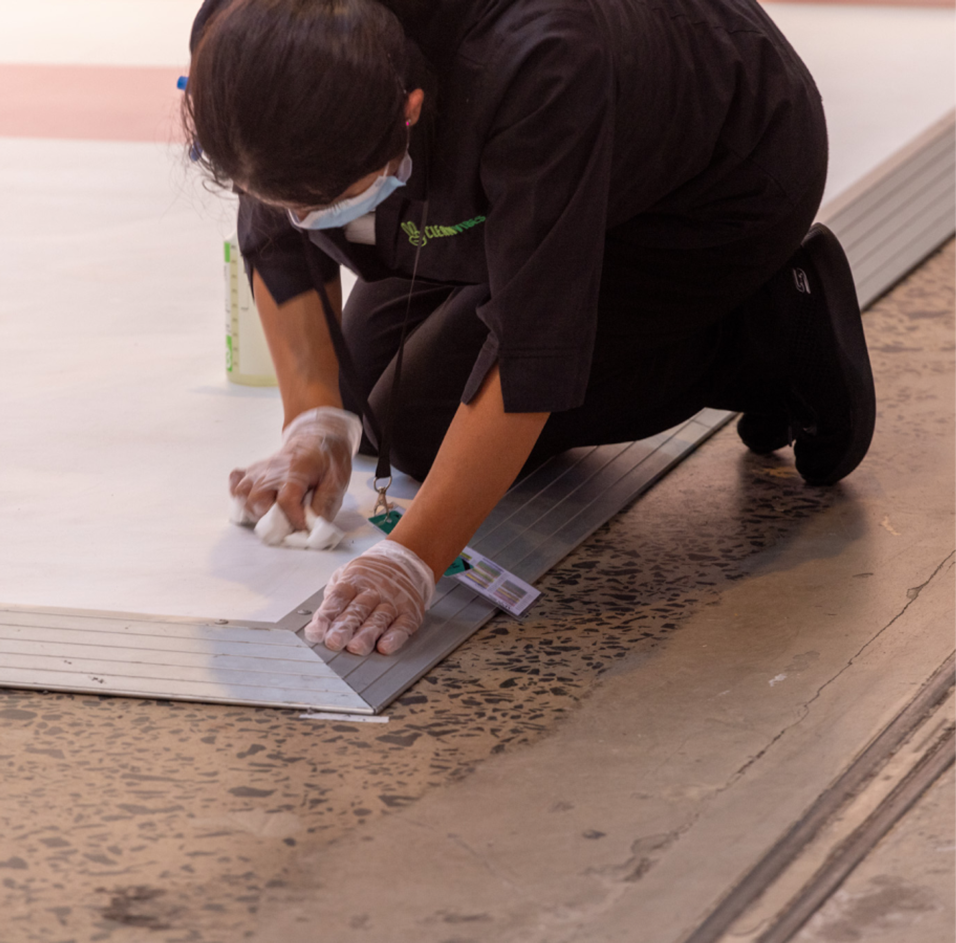 Clean Vibes staff cleaning Pandora's floor stand; Sydney Fashion week 2024