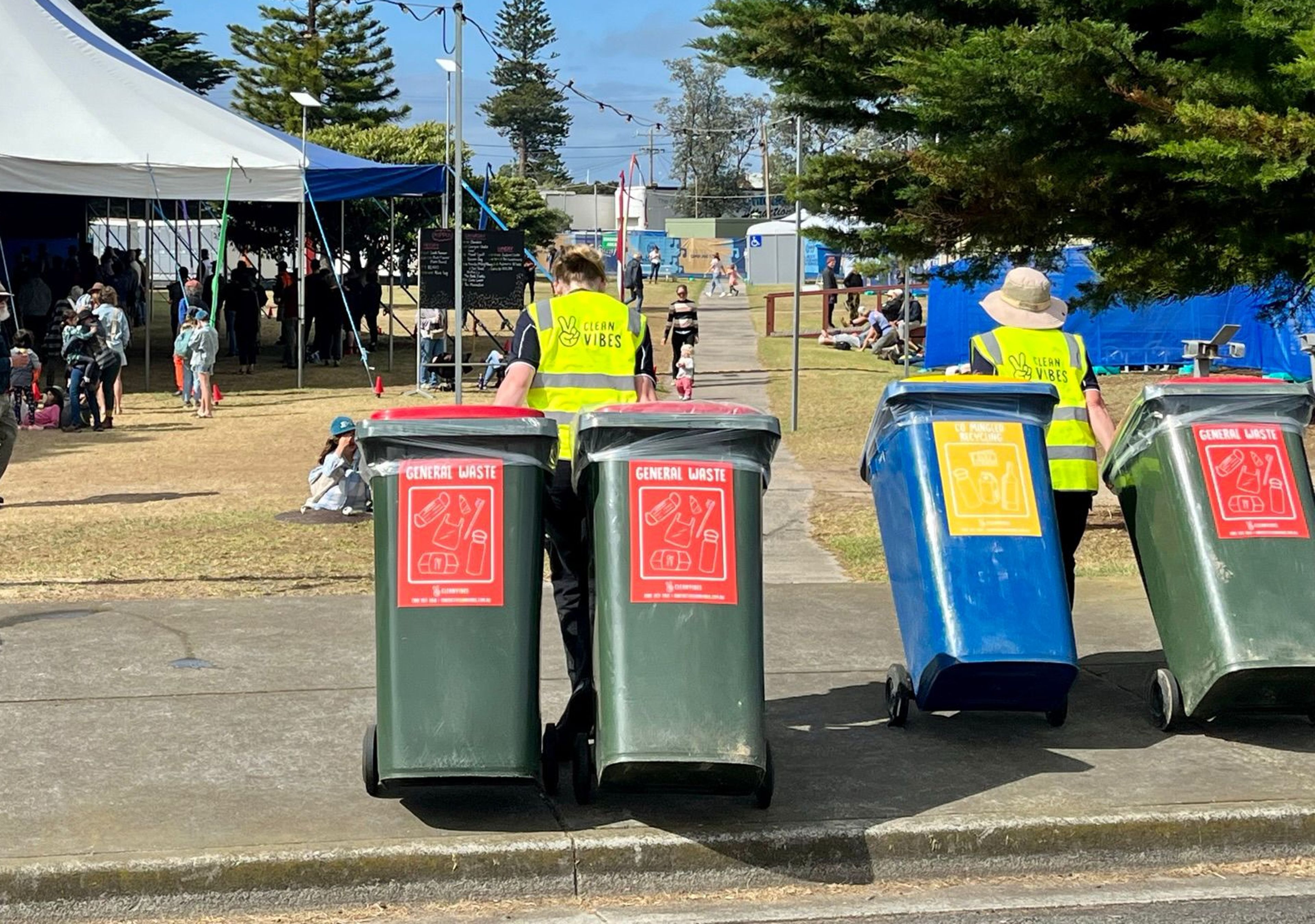 Clean Vibes casual staffs bringing empty bins back to the event