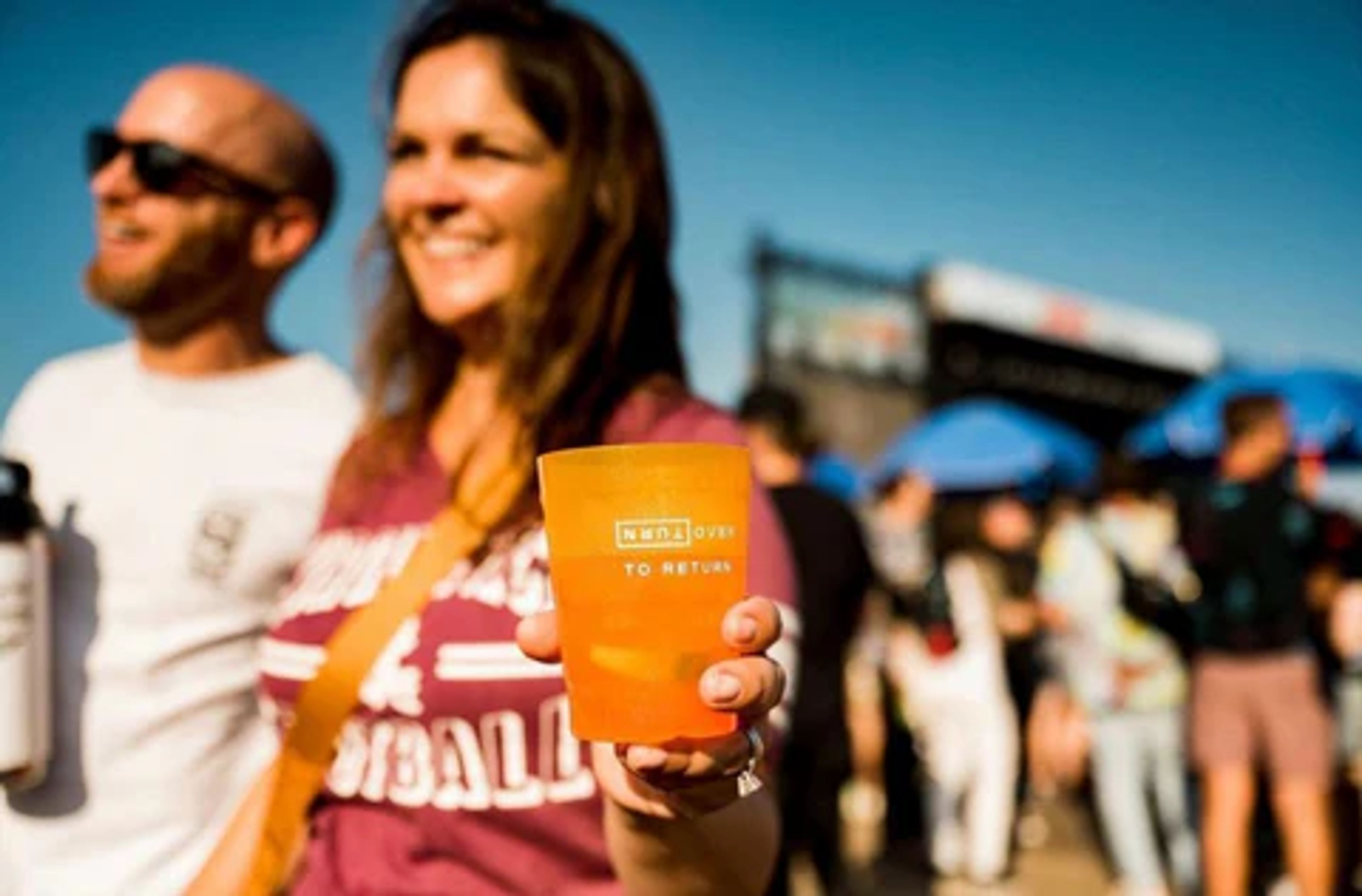 Festival goers with reusable cup