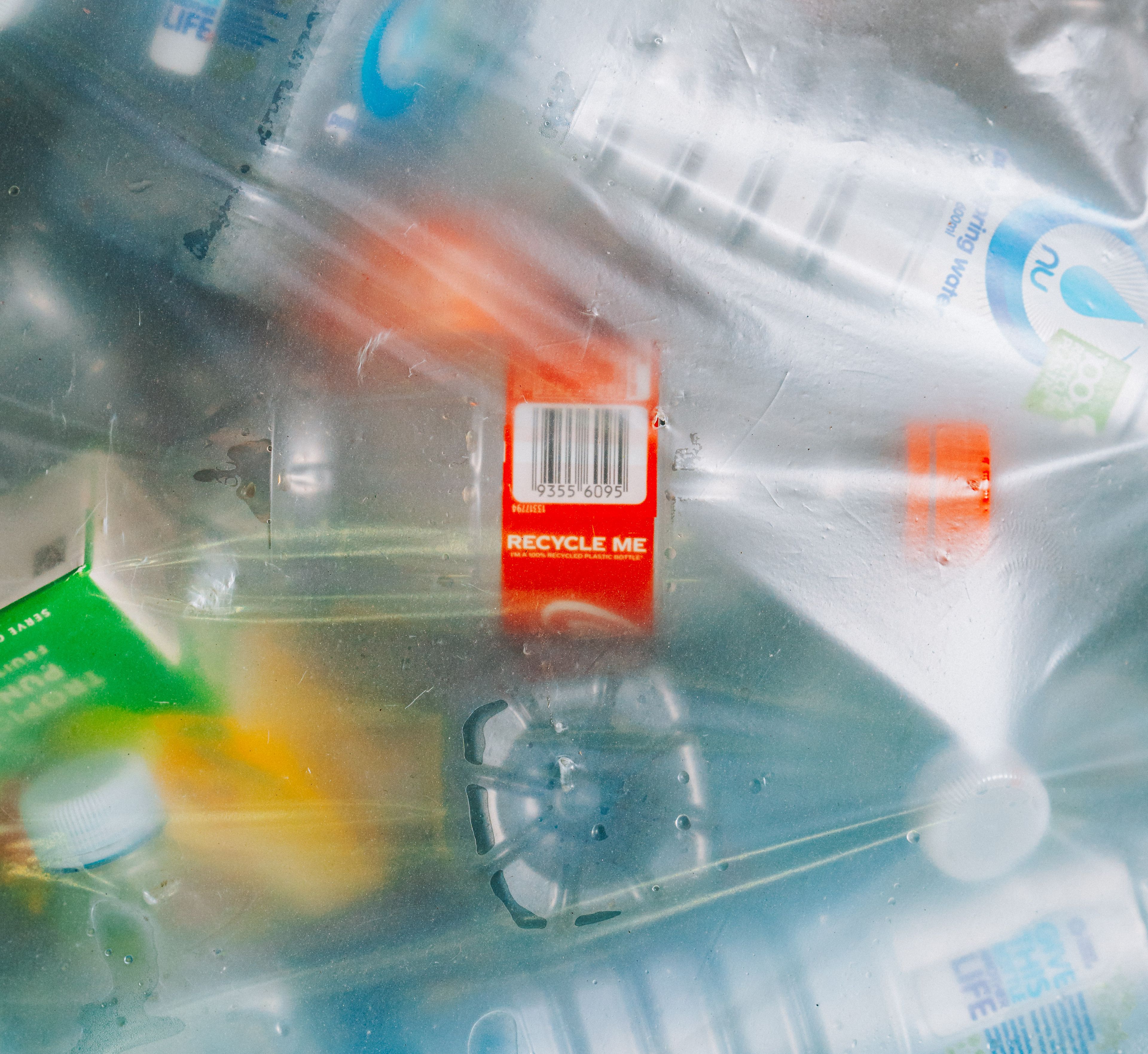 Plastic bottle with label recycle me